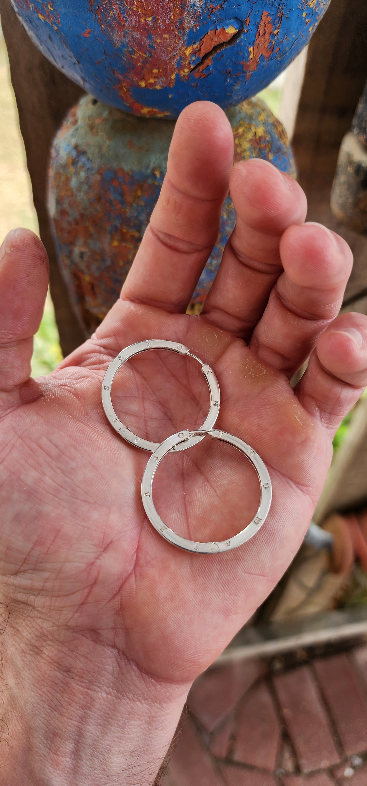 These oversized designer sterling silver hoop earrings are all about confident, no-nonsense glamour with a cool, modern edge.