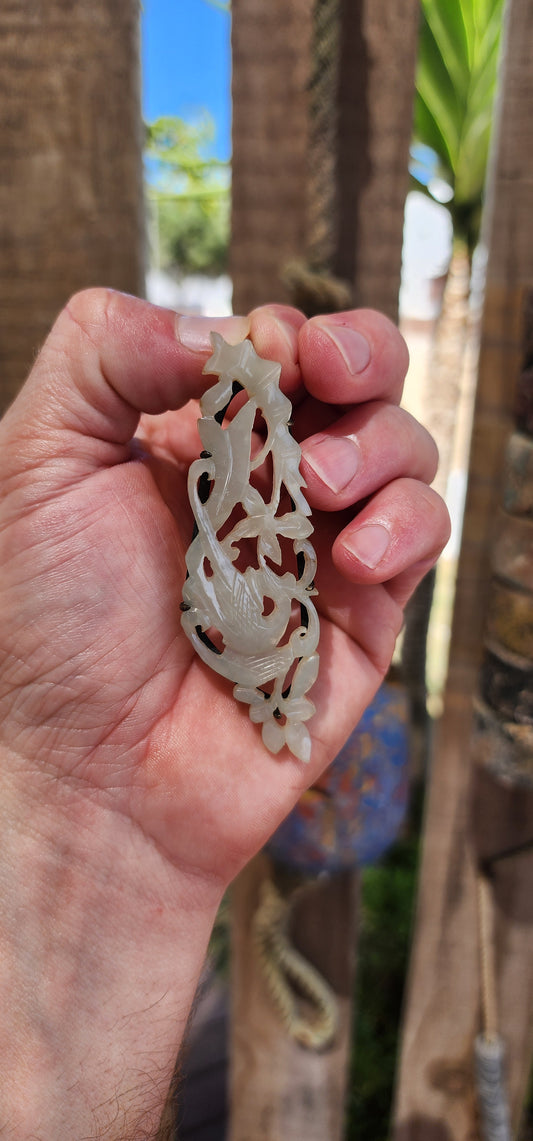 A truly soulful treasure from Imperial China, this generously sized pendant is exquisitely hand-carved from pale celadon Hetian (Hotan) jade and dates to the Qing Dynasty (circa mid–late 19th century, approx. 1800s).