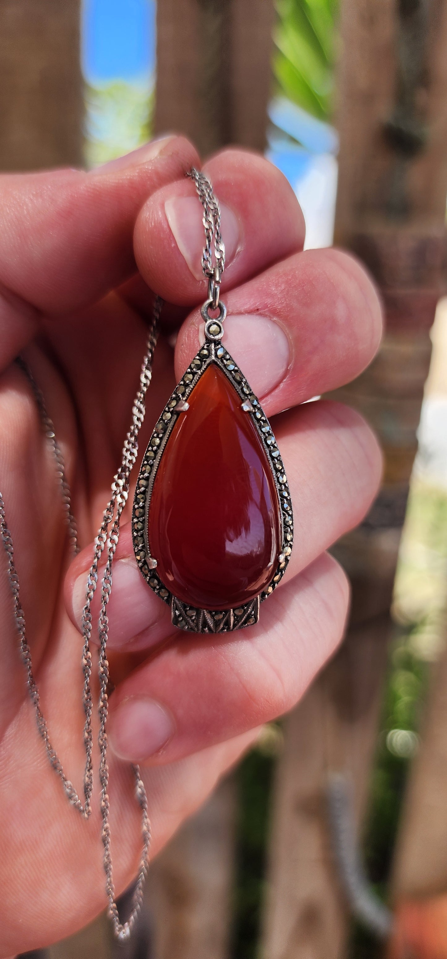 A truly fantastic and highly sought-after Art Deco treasure, this exquisite pendant dates to the circa 1920s and captures everything we adore about the Deco era — bold geometry, elegant symmetry, and rich materials.