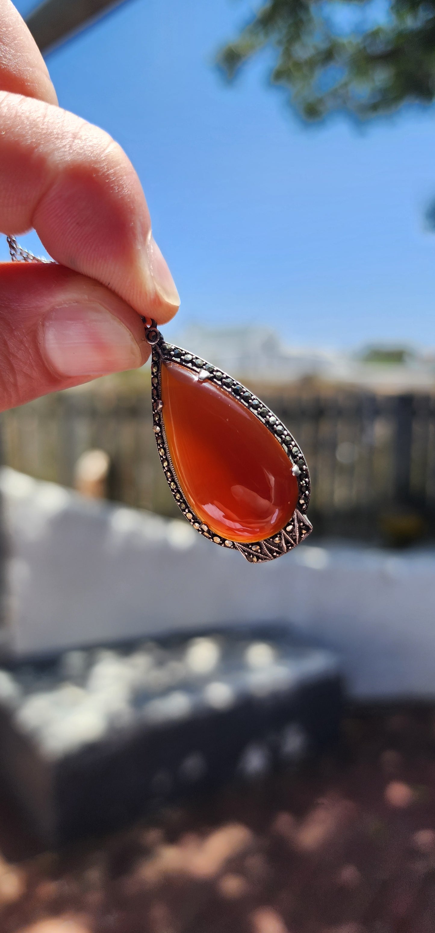 A truly fantastic and highly sought-after Art Deco treasure, this exquisite pendant dates to the circa 1920s and captures everything we adore about the Deco era — bold geometry, elegant symmetry, and rich materials.