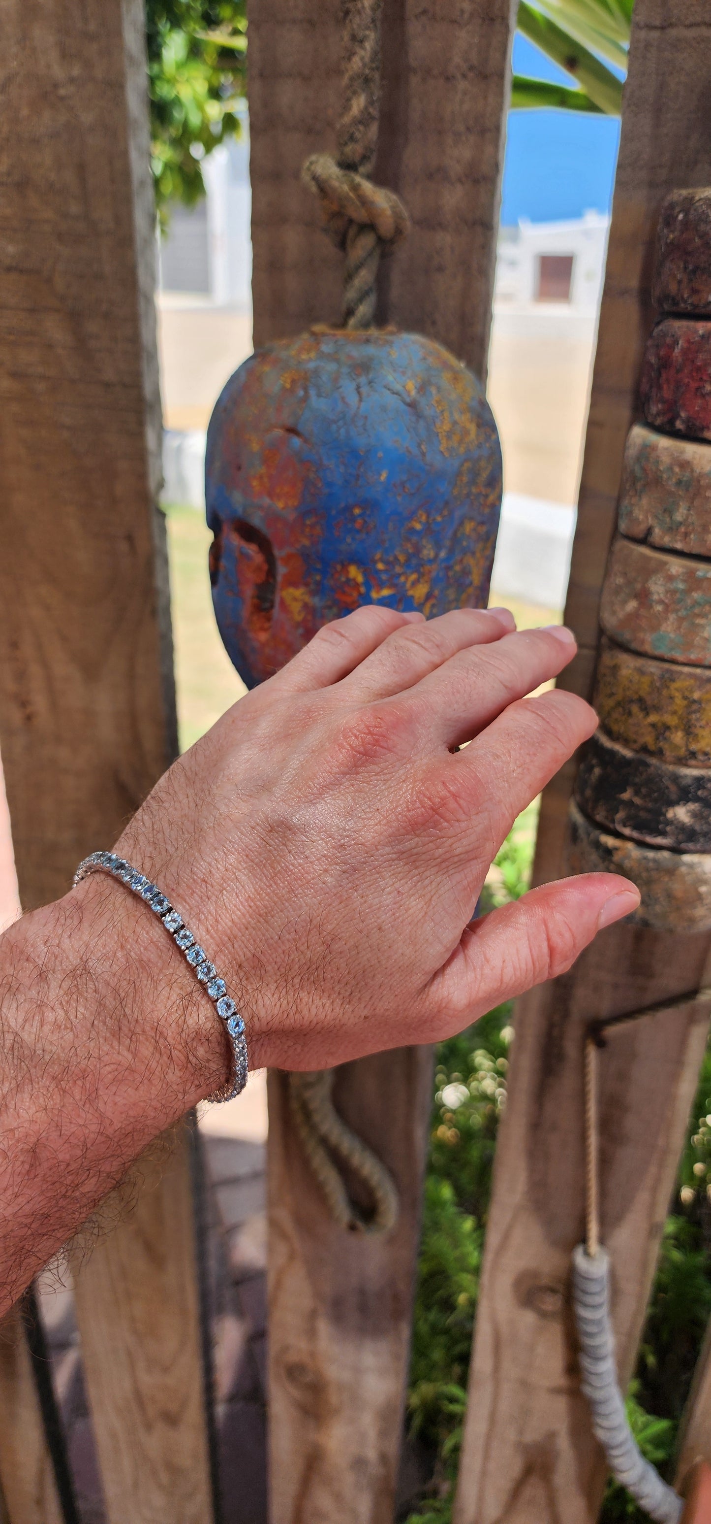 Effortlessly refined with a fresh, luminous glow, this classic tennis bracelet is crafted in polished sterling silver and set with a continuous line of sparkling sky blue topaz gemstones.
