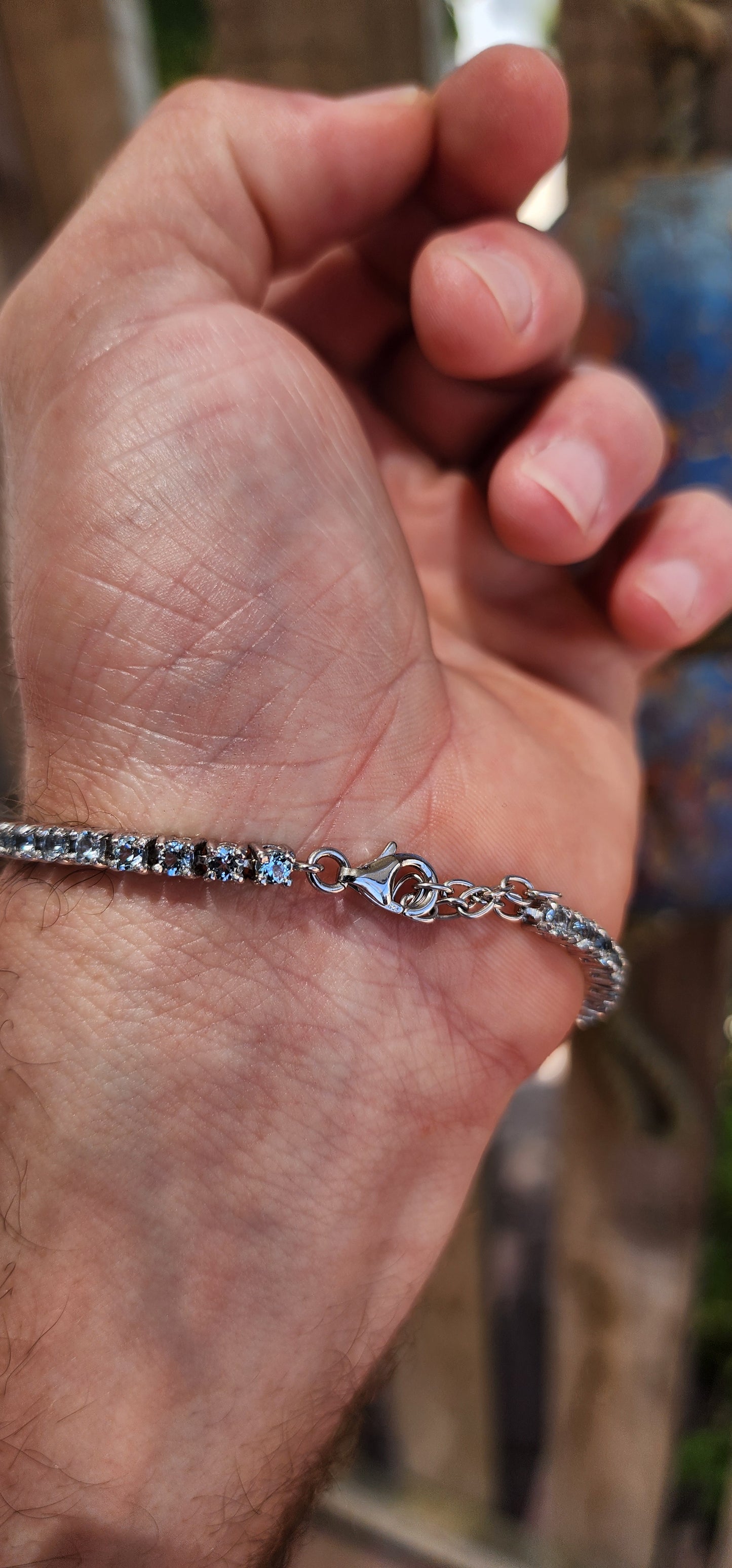 Effortlessly refined with a fresh, luminous glow, this classic tennis bracelet is crafted in polished sterling silver and set with a continuous line of sparkling sky blue topaz gemstones.