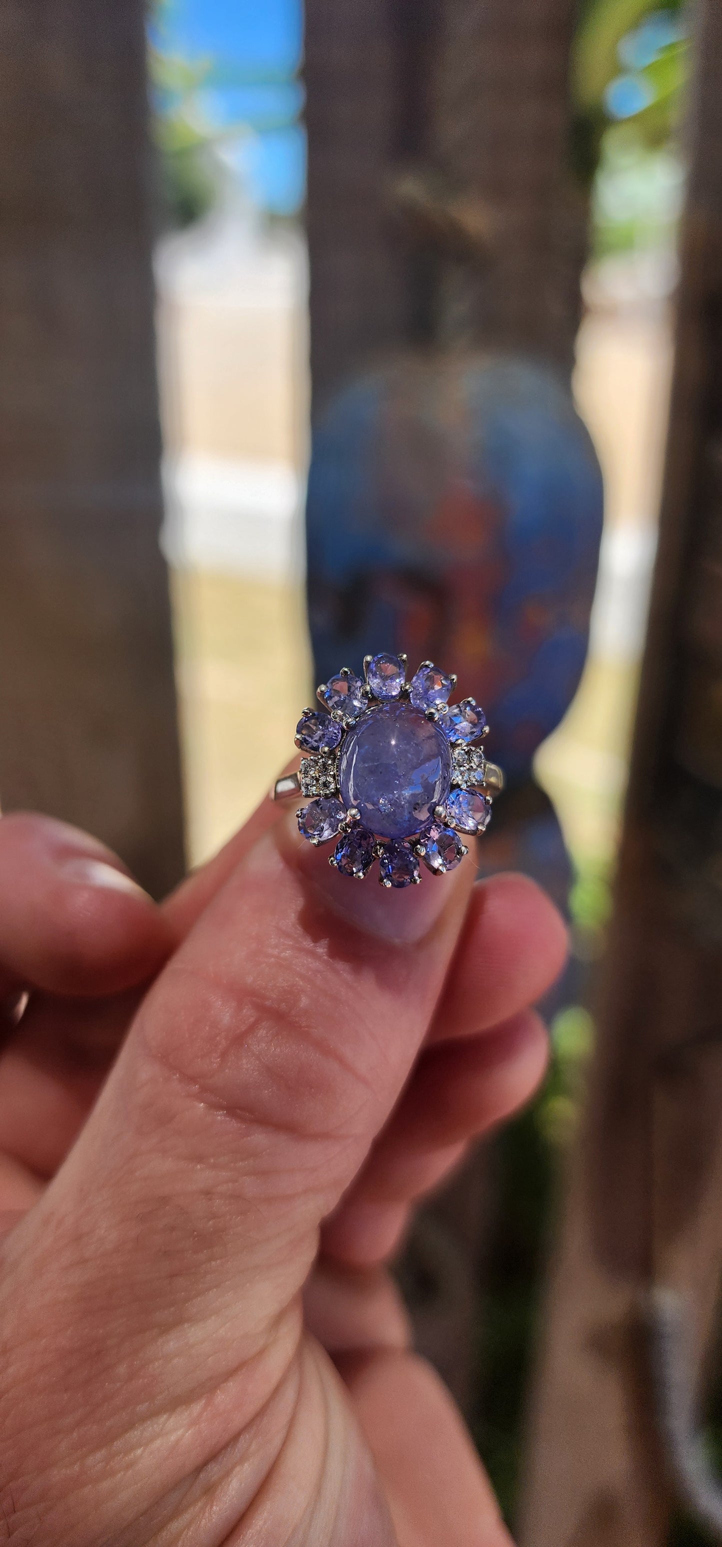 WOW… she’s magic — Tanzanite Halo / Cluster Dress Ring in Sterling Silver.