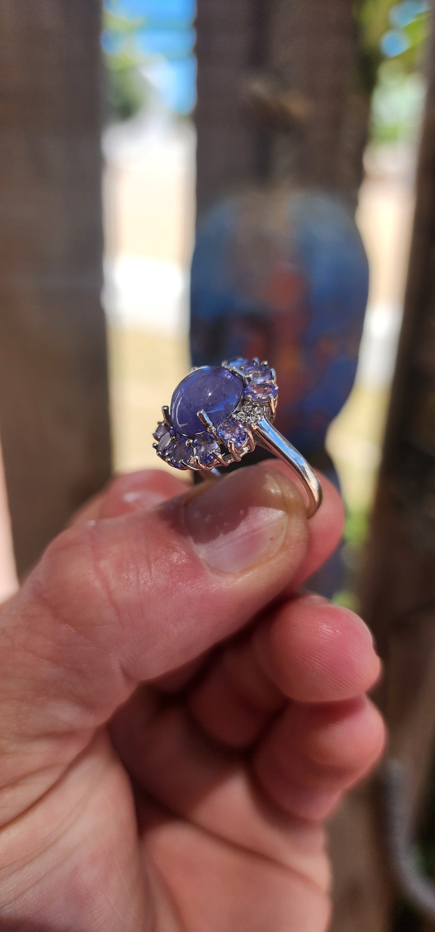 WOW… she’s magic — Tanzanite Halo / Cluster Dress Ring in Sterling Silver.