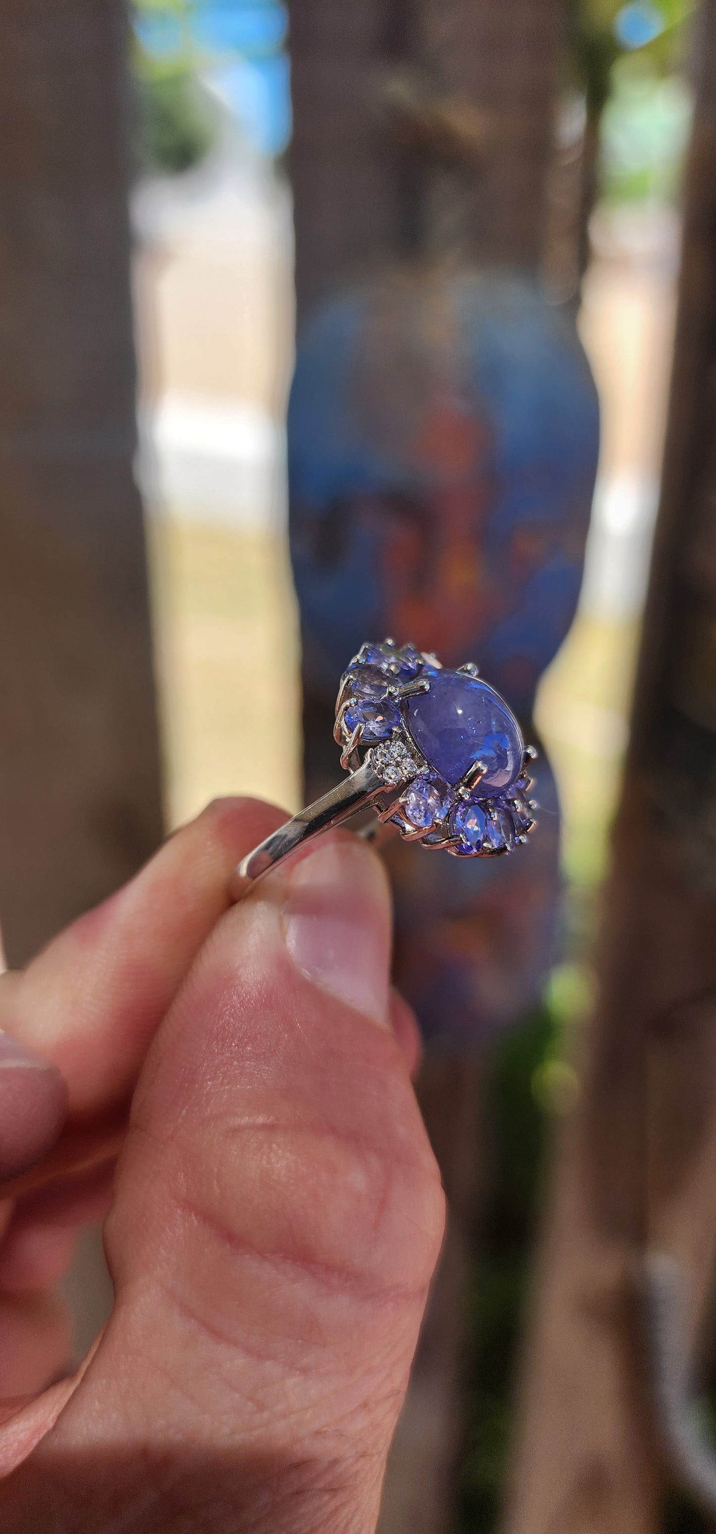 WOW… she’s magic — Tanzanite Halo / Cluster Dress Ring in Sterling Silver.