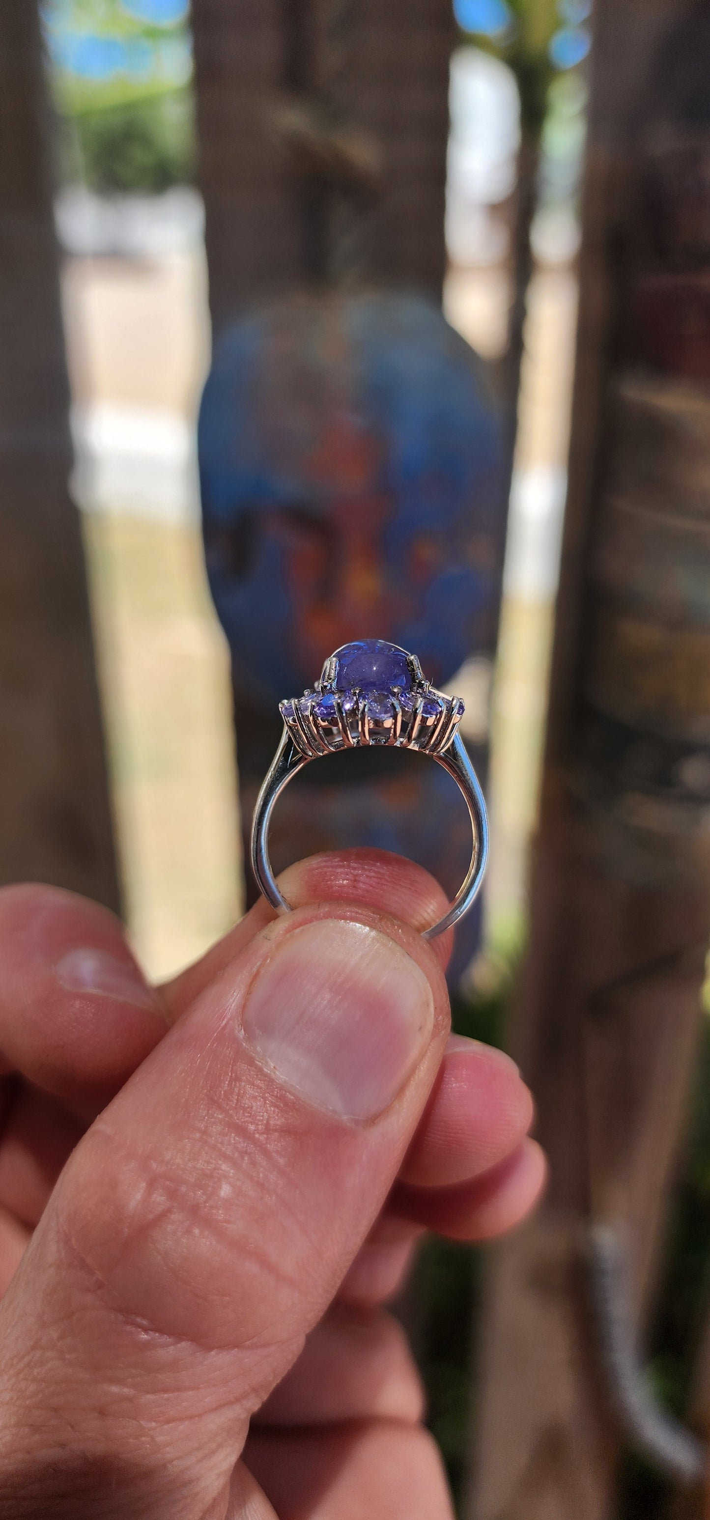 WOW… she’s magic — Tanzanite Halo / Cluster Dress Ring in Sterling Silver.
