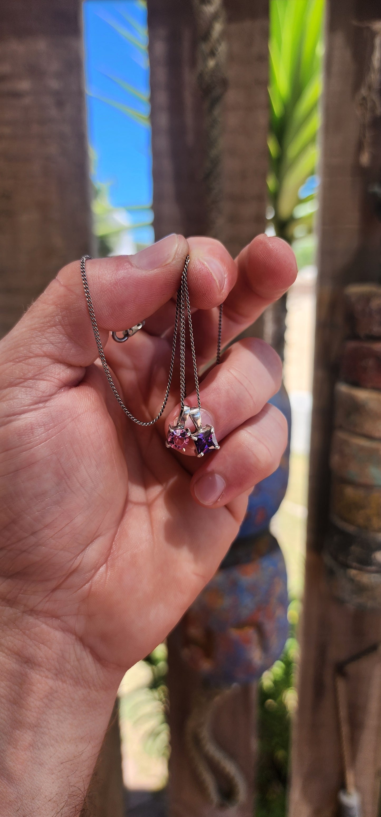 Double the charm, double the sparkle! This playful little beauty features two minimalist sterling silver pendants suspended together on a fine sterling silver chain.