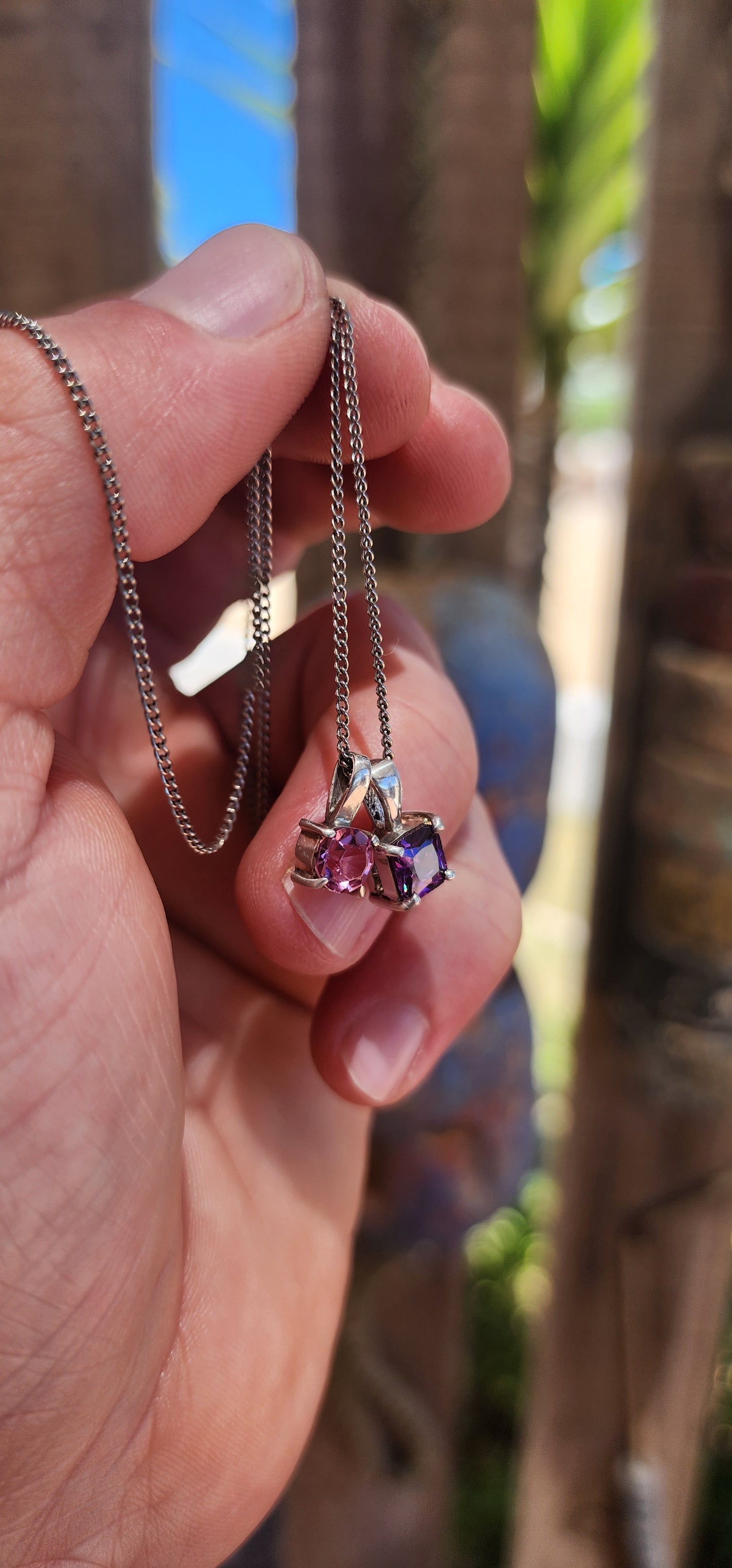Double the charm, double the sparkle! This playful little beauty features two minimalist sterling silver pendants suspended together on a fine sterling silver chain.