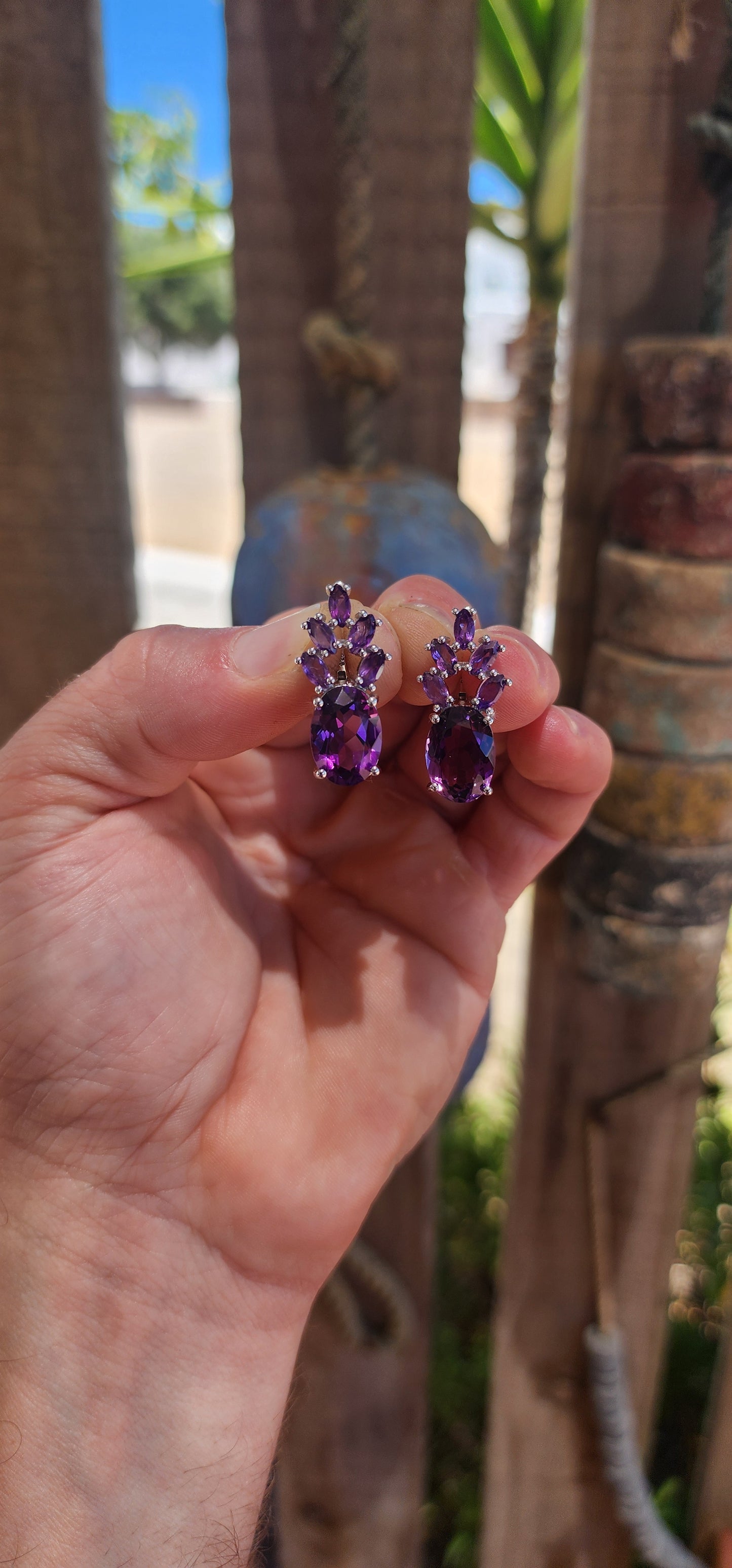 These jaw-dropping sterling silver statement earrings are like amethyst bouquets blooming right from your lobes — regal, sparkly, and dripping in violet luxury.