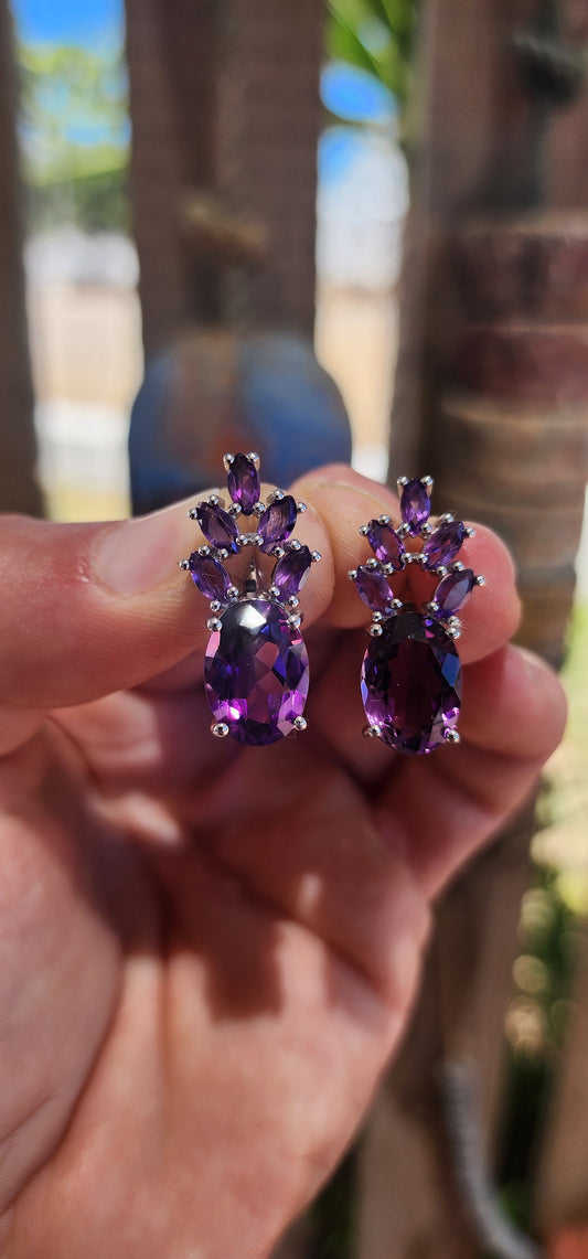 These jaw-dropping sterling silver statement earrings are like amethyst bouquets blooming right from your lobes — regal, sparkly, and dripping in violet luxury.