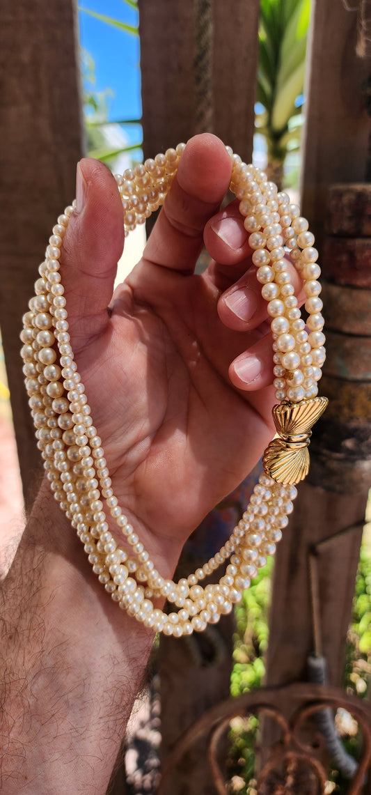 This stunning vintage Crown Trifari choker features six lush strands of faux pearls, beautifully graduated in size for that rich, layered “old money” effect.