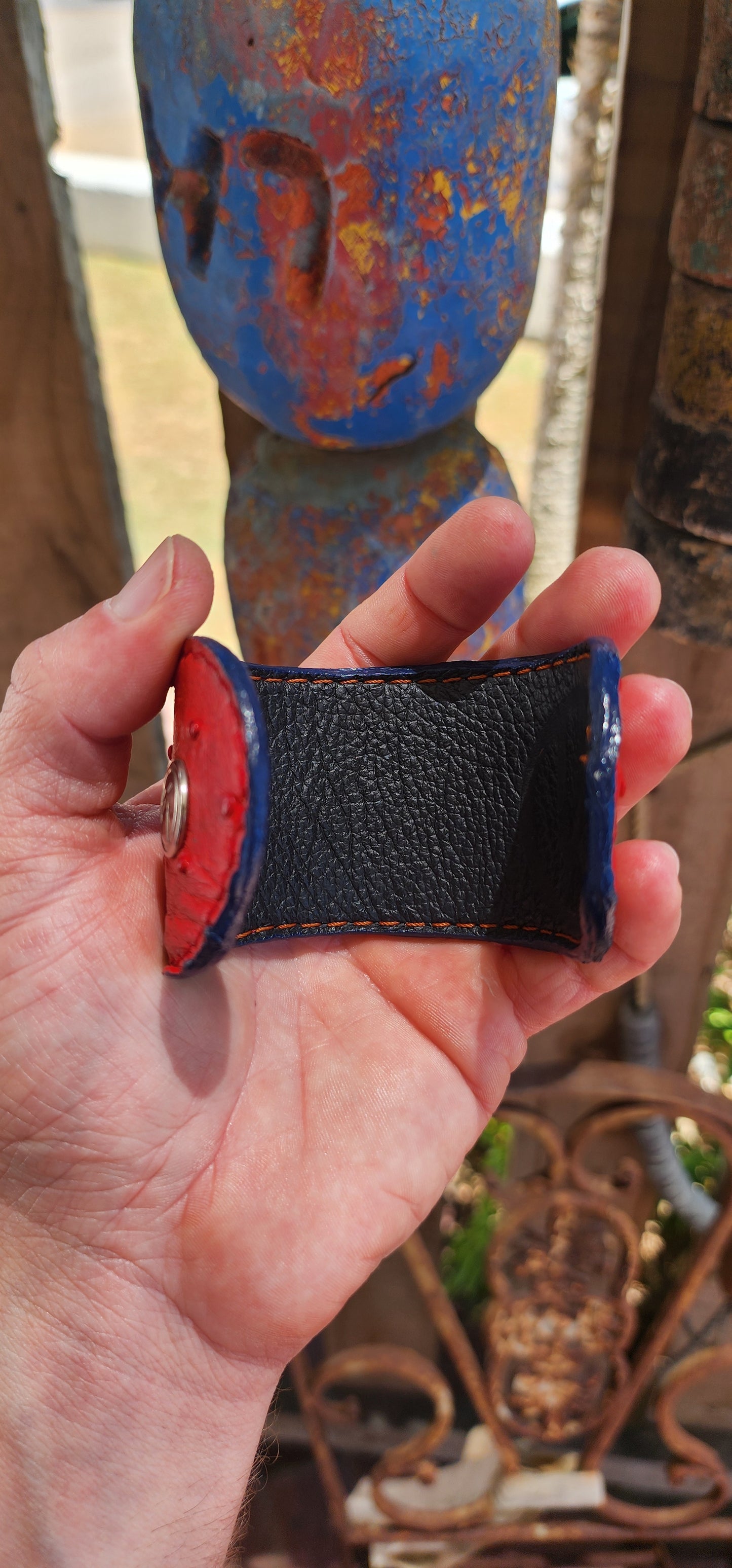 This high-quality artisan-made cuff is crafted from genuine ostrich leather in the most delicious rich red shade — a colour that instantly commands attention.