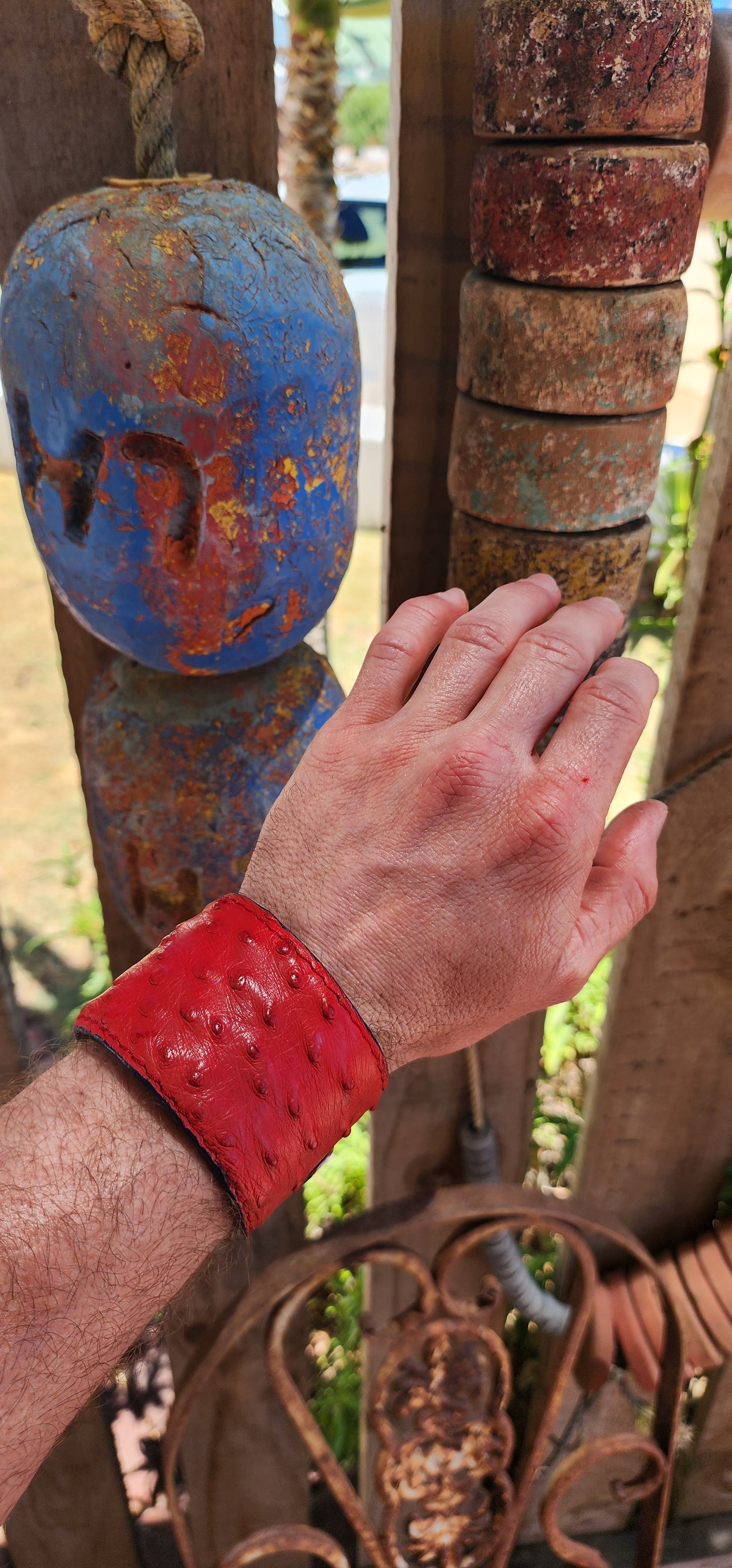 This high-quality artisan-made cuff is crafted from genuine ostrich leather in the most delicious rich red shade — a colour that instantly commands attention.