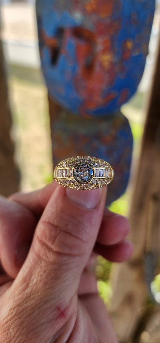 Classical, elegant, and unapologetically glamorous — this stunning sterling silver dress ring has been luxuriously finished in 18ct yellow gold plating, giving it that rich, high-end golden glow.