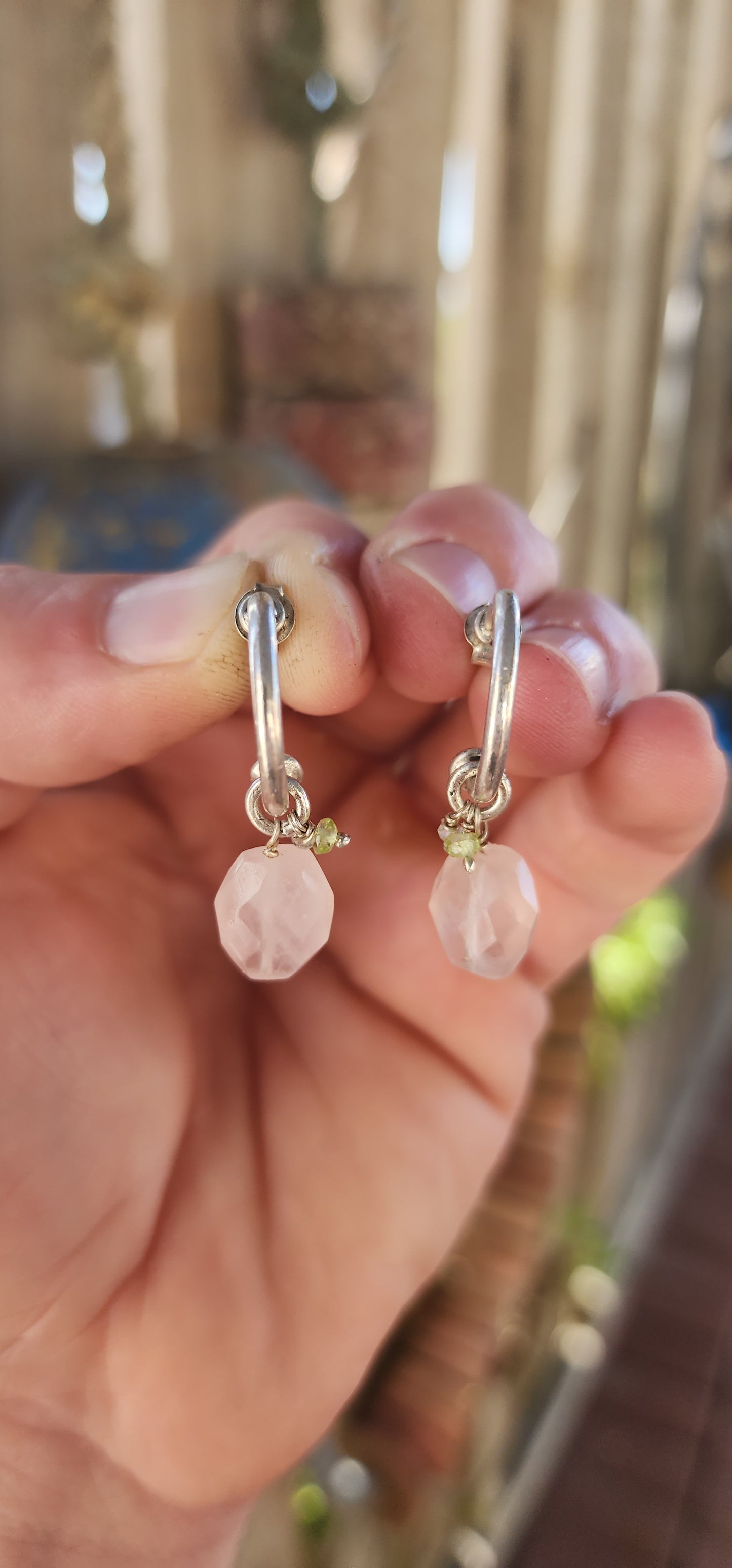A gorgeous artisan-made pair of sterling silver half-hoop / huggie style earrings, designed with a clean modern silhouette and the sweetest little gemstone charm dangles.