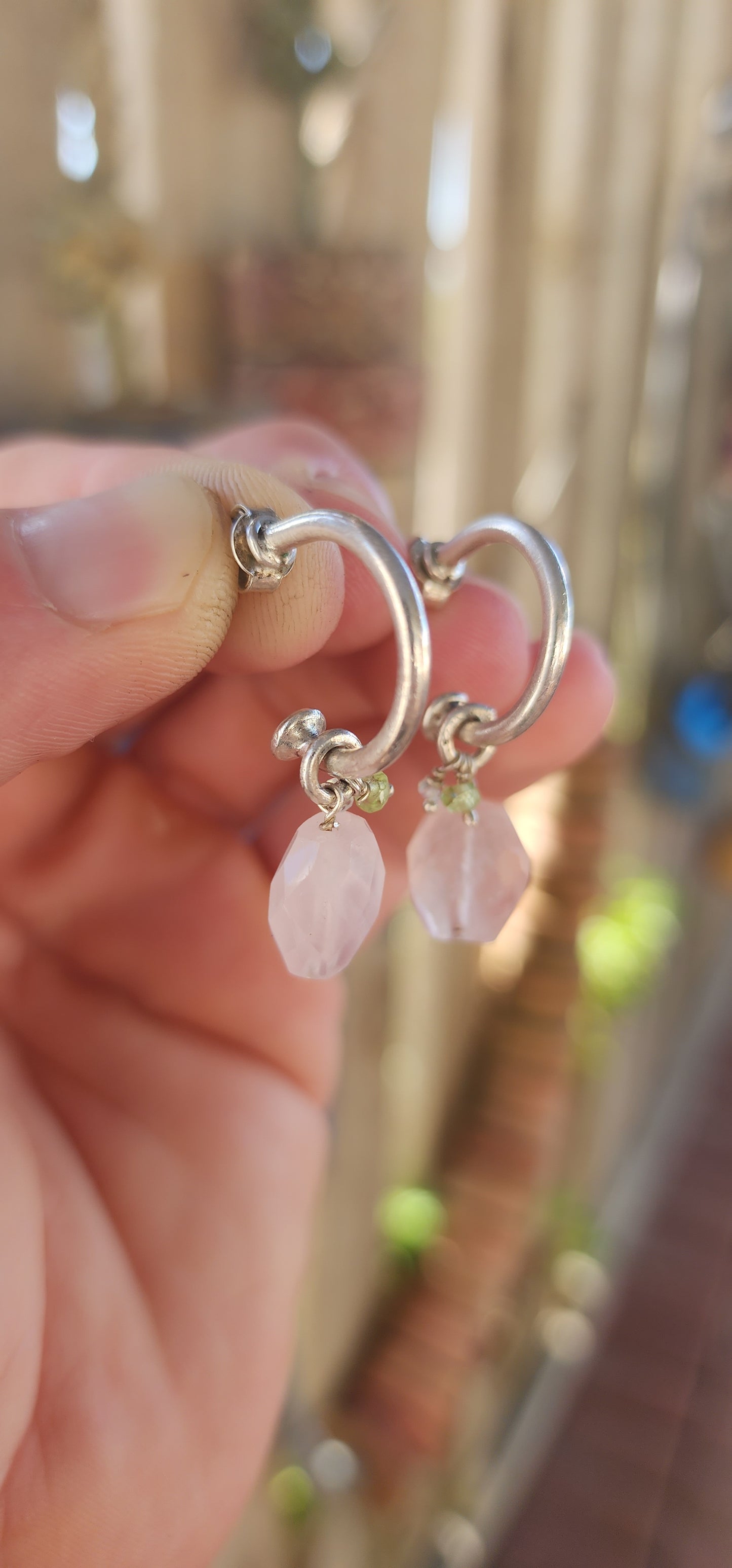 A gorgeous artisan-made pair of sterling silver half-hoop / huggie style earrings, designed with a clean modern silhouette and the sweetest little gemstone charm dangles.