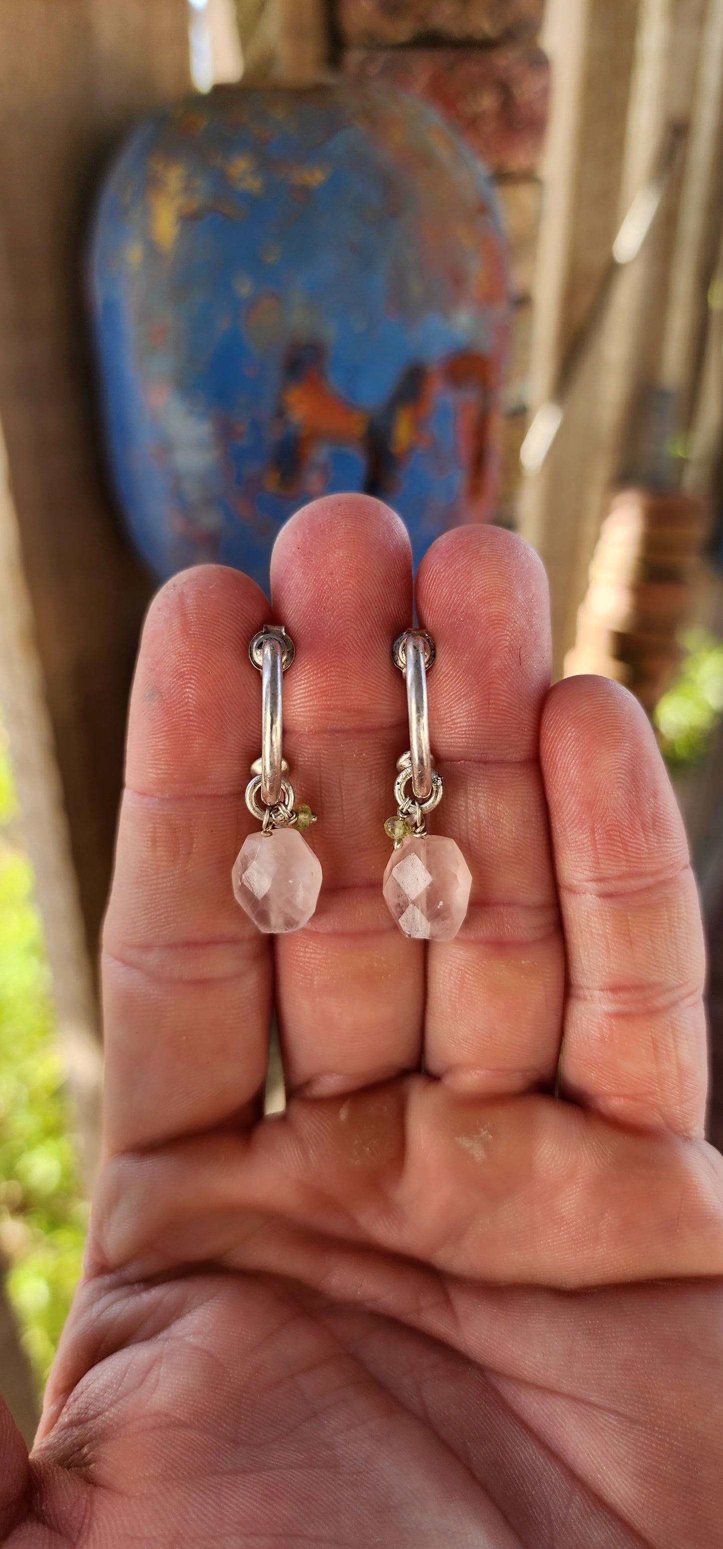 A gorgeous artisan-made pair of sterling silver half-hoop / huggie style earrings, designed with a clean modern silhouette and the sweetest little gemstone charm dangles.