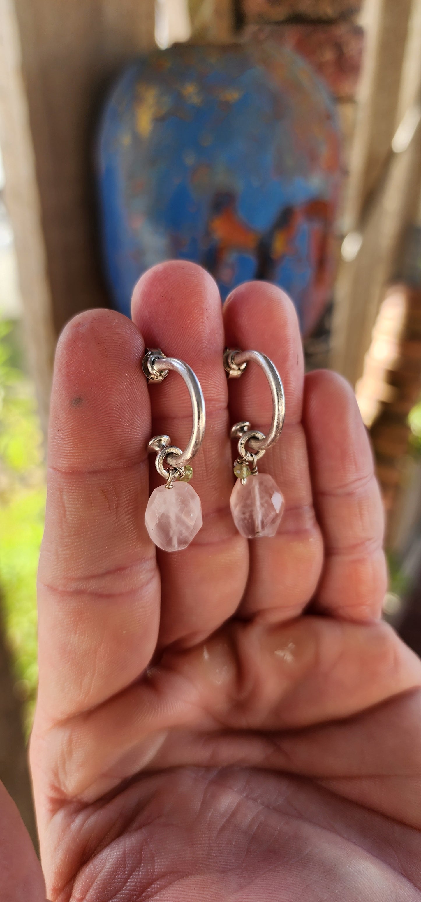 A gorgeous artisan-made pair of sterling silver half-hoop / huggie style earrings, designed with a clean modern silhouette and the sweetest little gemstone charm dangles.