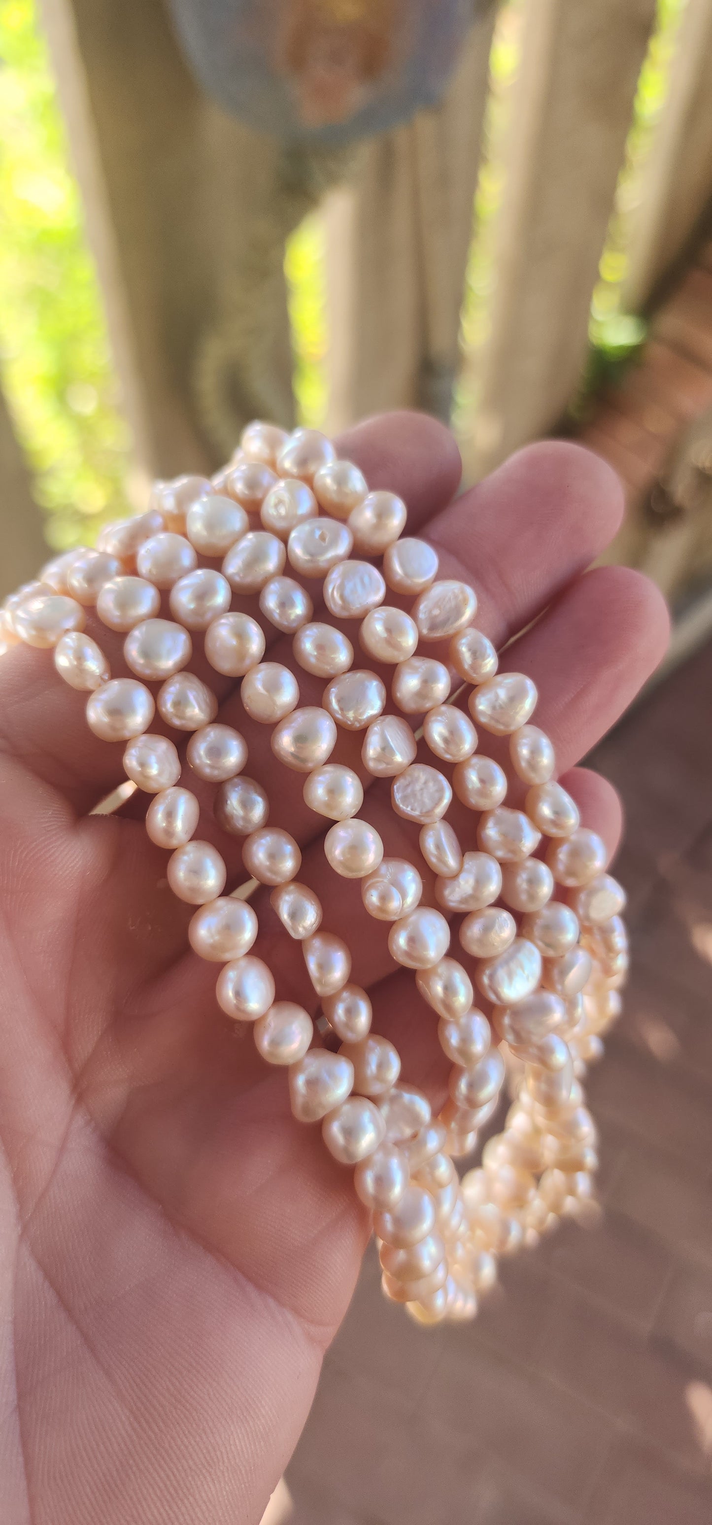 Elegant and seriously luxurious — this handmade three-strand freshwater pearl necklace is a classical beauty with a modern edge.