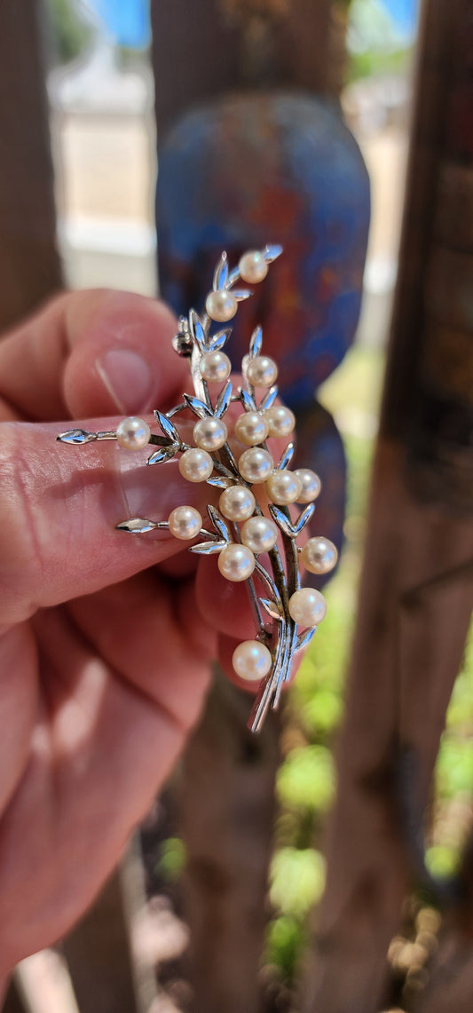 A marvelous and generously sized 1950’s pearl spray brooch crafted in sterling silver and set with beautiful Japanese Akoya cultured pearls.