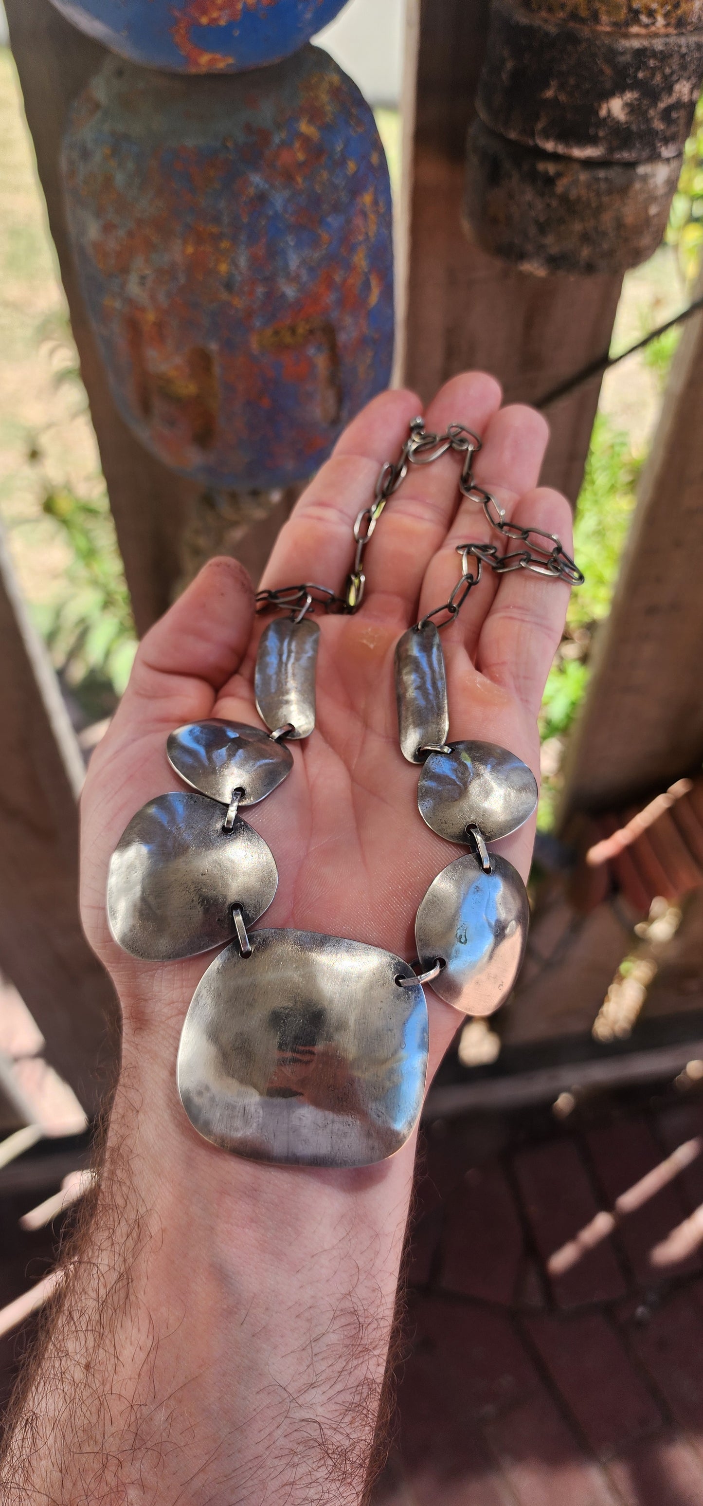 This powerful statement necklace carries the soul of traditional tribal adornment fused with sculptural modernist design.