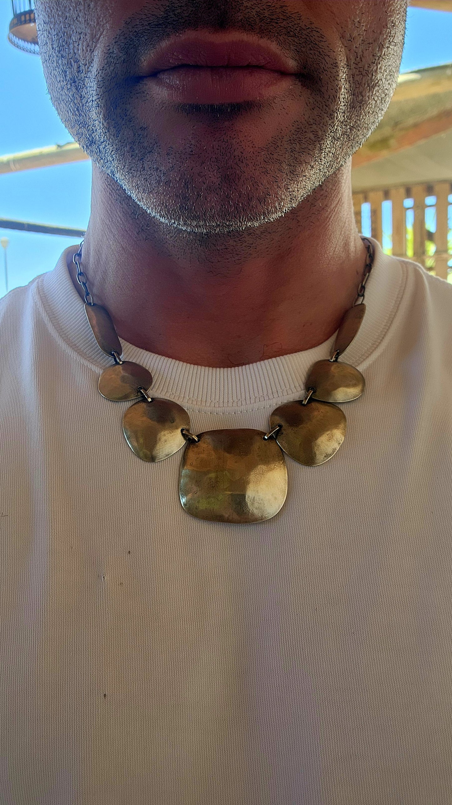 This powerful statement necklace carries the soul of traditional tribal adornment fused with sculptural modernist design.