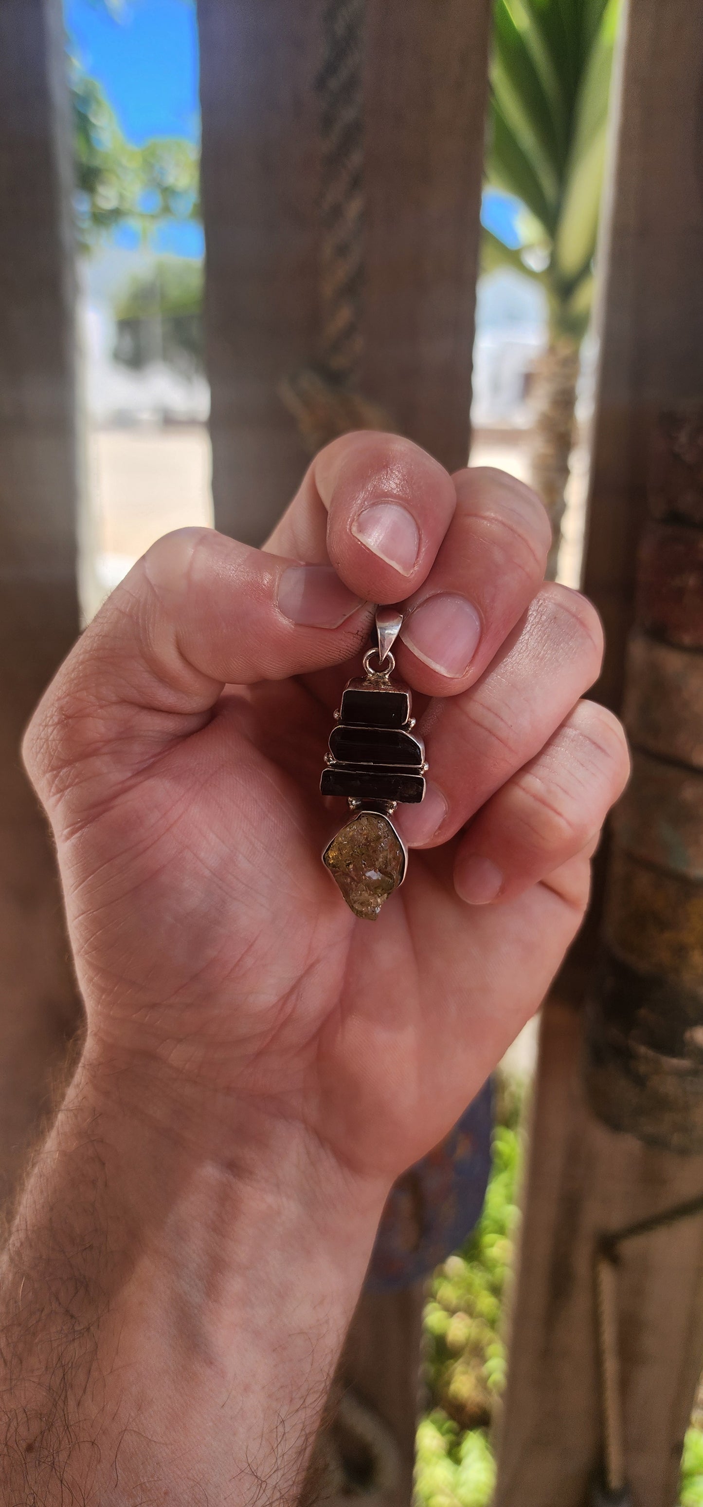 Earthy. Elemental. One-of-a-kind energy. This generously sized handmade pendant is crafted in solid sterling silver and showcases the untamed beauty of raw gemstone specimens.