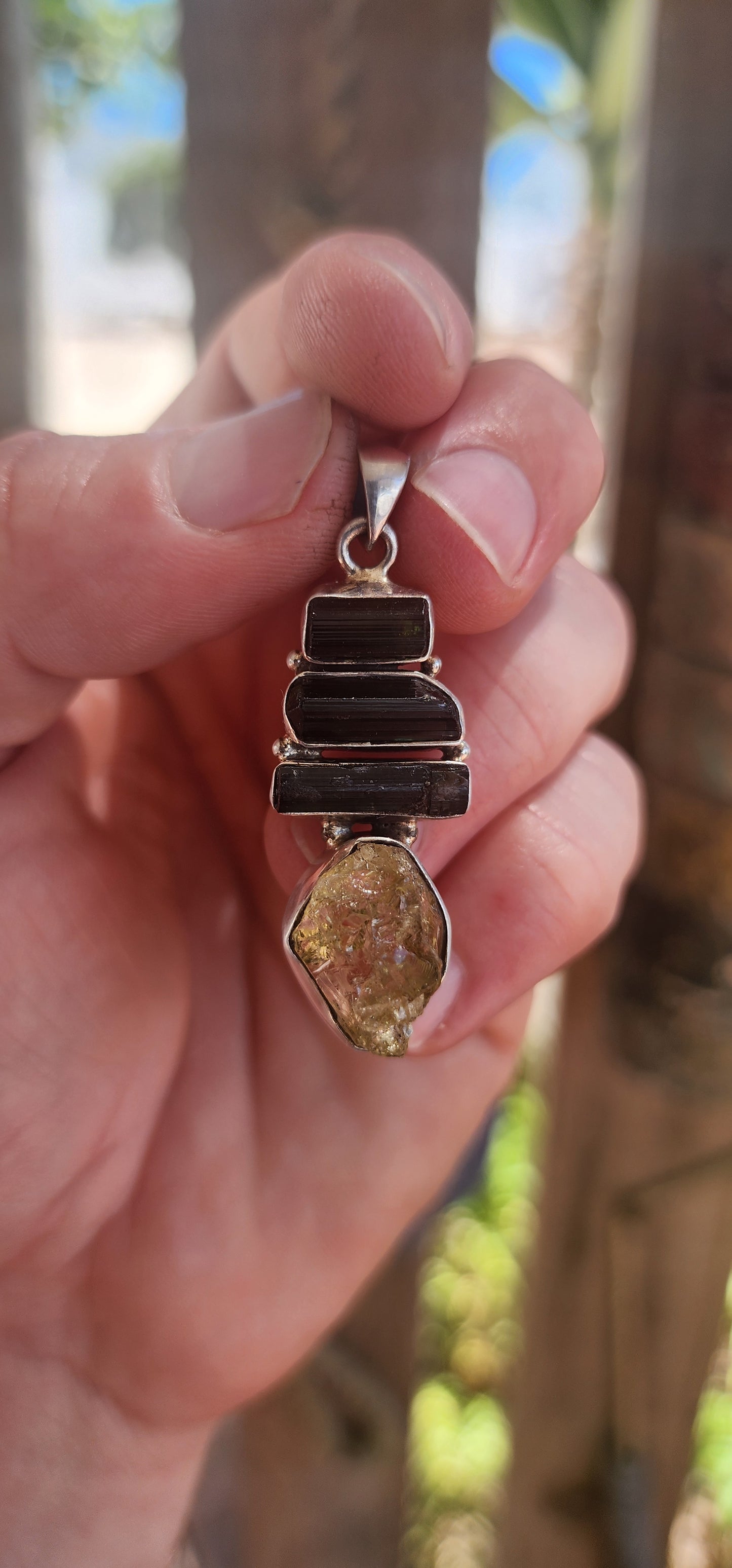 Earthy. Elemental. One-of-a-kind energy. This generously sized handmade pendant is crafted in solid sterling silver and showcases the untamed beauty of raw gemstone specimens.