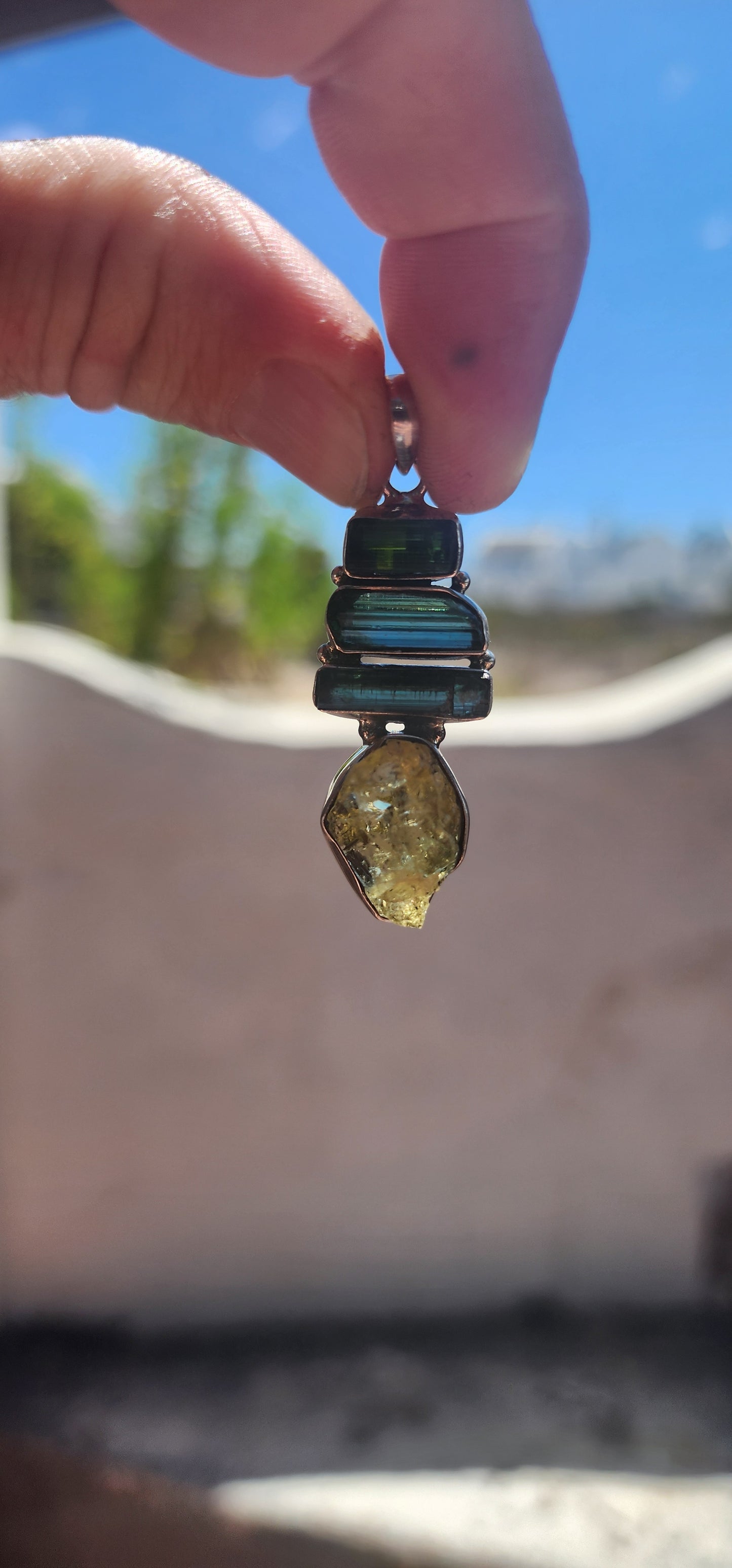 Earthy. Elemental. One-of-a-kind energy. This generously sized handmade pendant is crafted in solid sterling silver and showcases the untamed beauty of raw gemstone specimens.