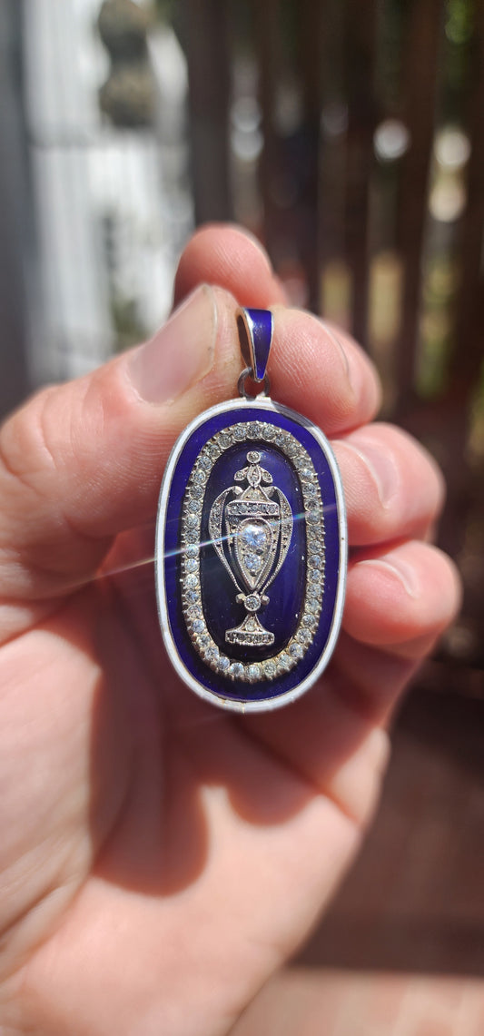 An exceptionally rare early 19th-century Georgian mourning pendant, crafted in sterling silver and lavishly decorated with royal blue and white enamel, glittering paste stones, and natural diamonds.