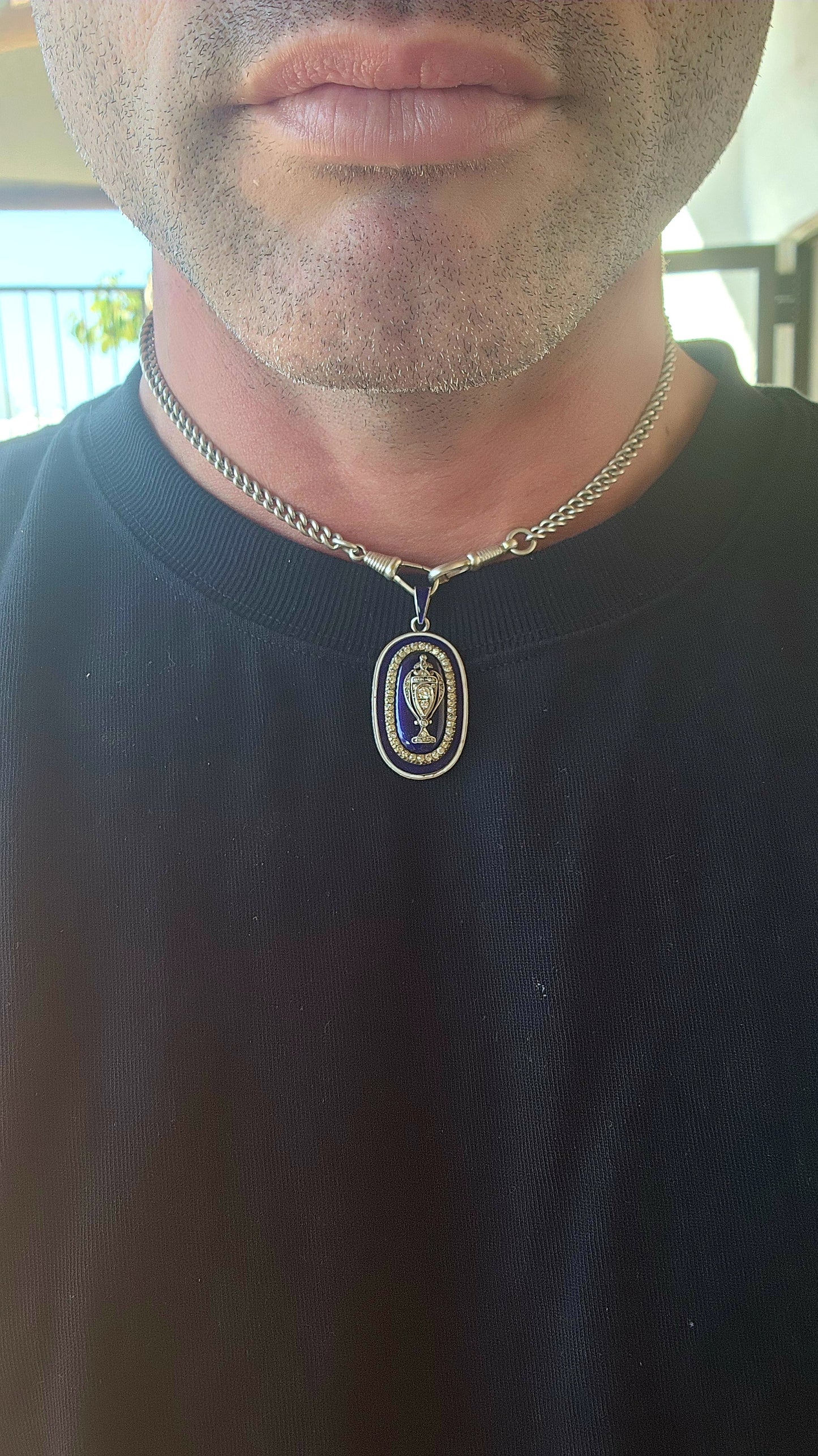 An exceptionally rare early 19th-century Georgian mourning pendant, crafted in sterling silver and lavishly decorated with royal blue and white enamel, glittering paste stones, and natural diamonds.