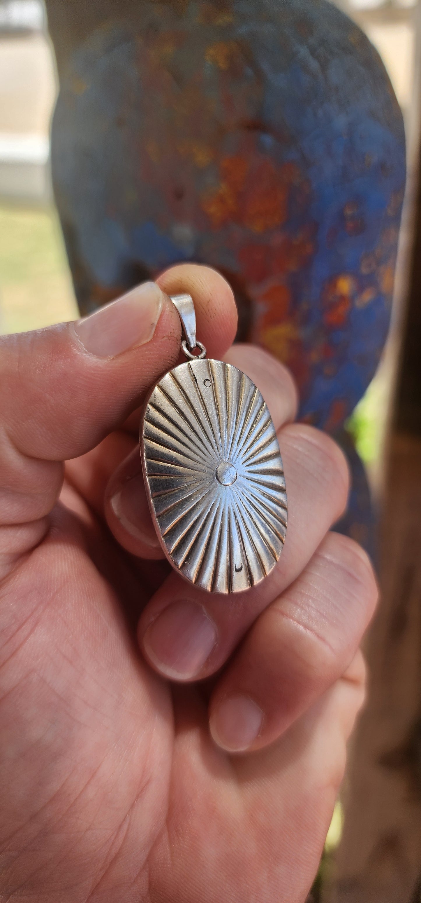 An exceptionally rare early 19th-century Georgian mourning pendant, crafted in sterling silver and lavishly decorated with royal blue and white enamel, glittering paste stones, and natural diamonds.