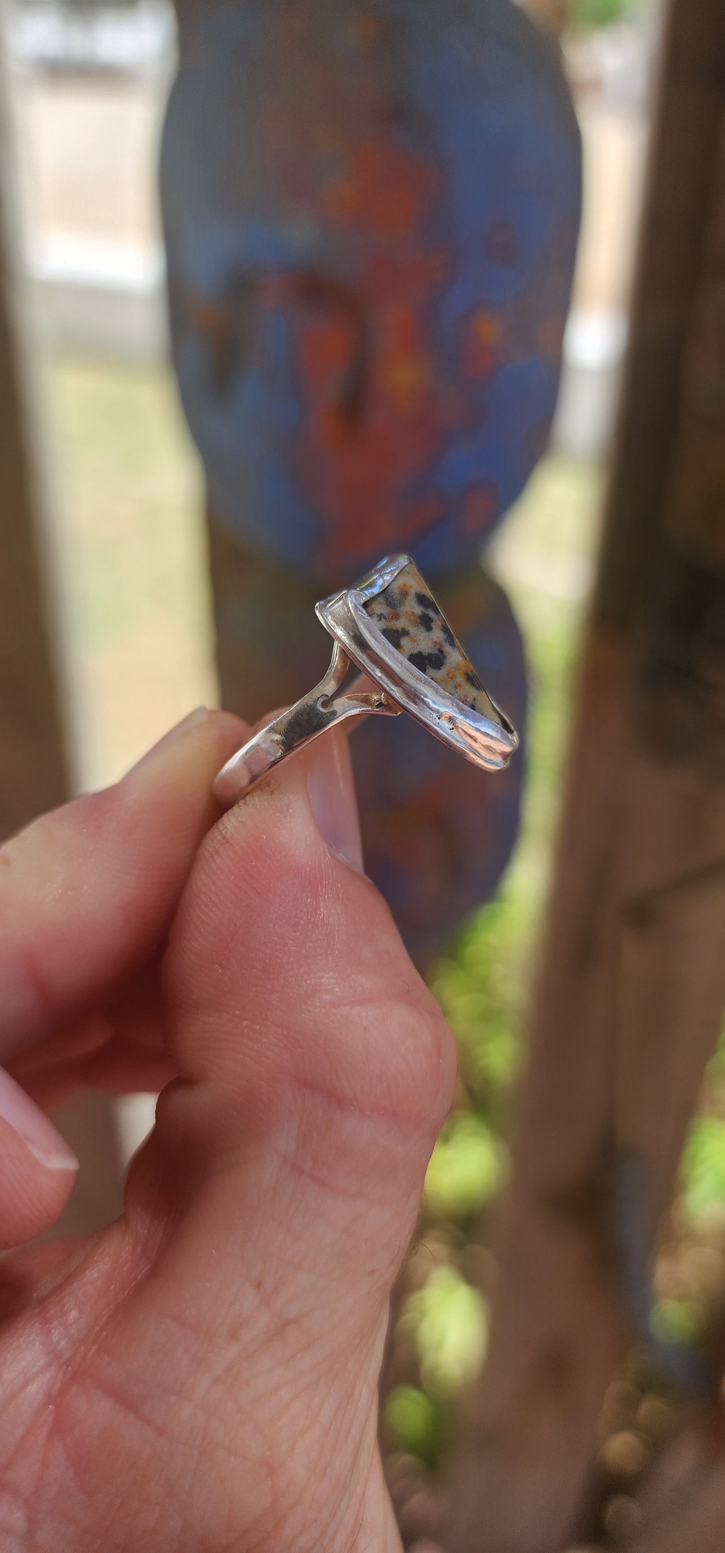 A striking artisan-made sterling silver dress ring, designed around a beautifully irregular, organically shaped Dalmatian Jasper cabochon.