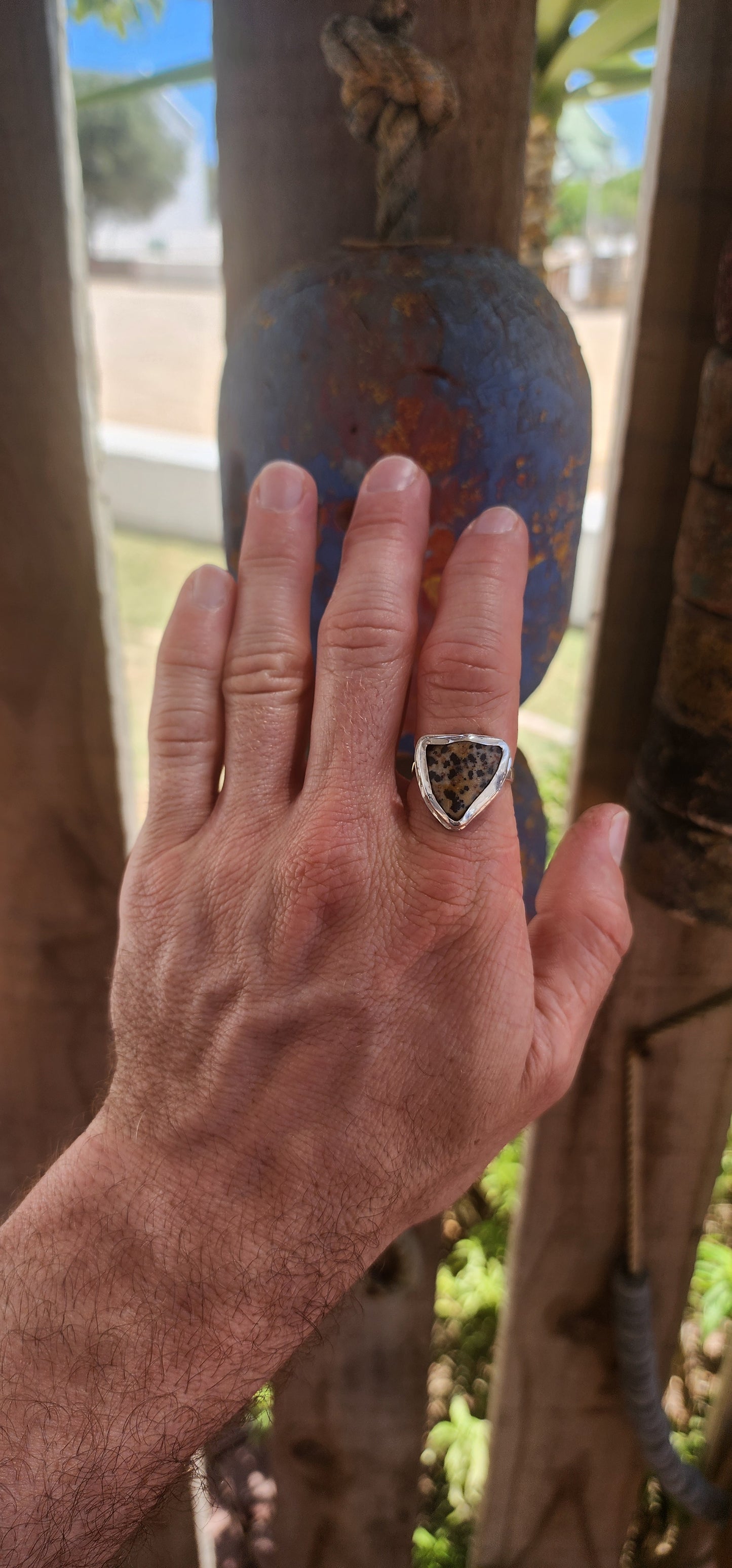 A striking artisan-made sterling silver dress ring, designed around a beautifully irregular, organically shaped Dalmatian Jasper cabochon.