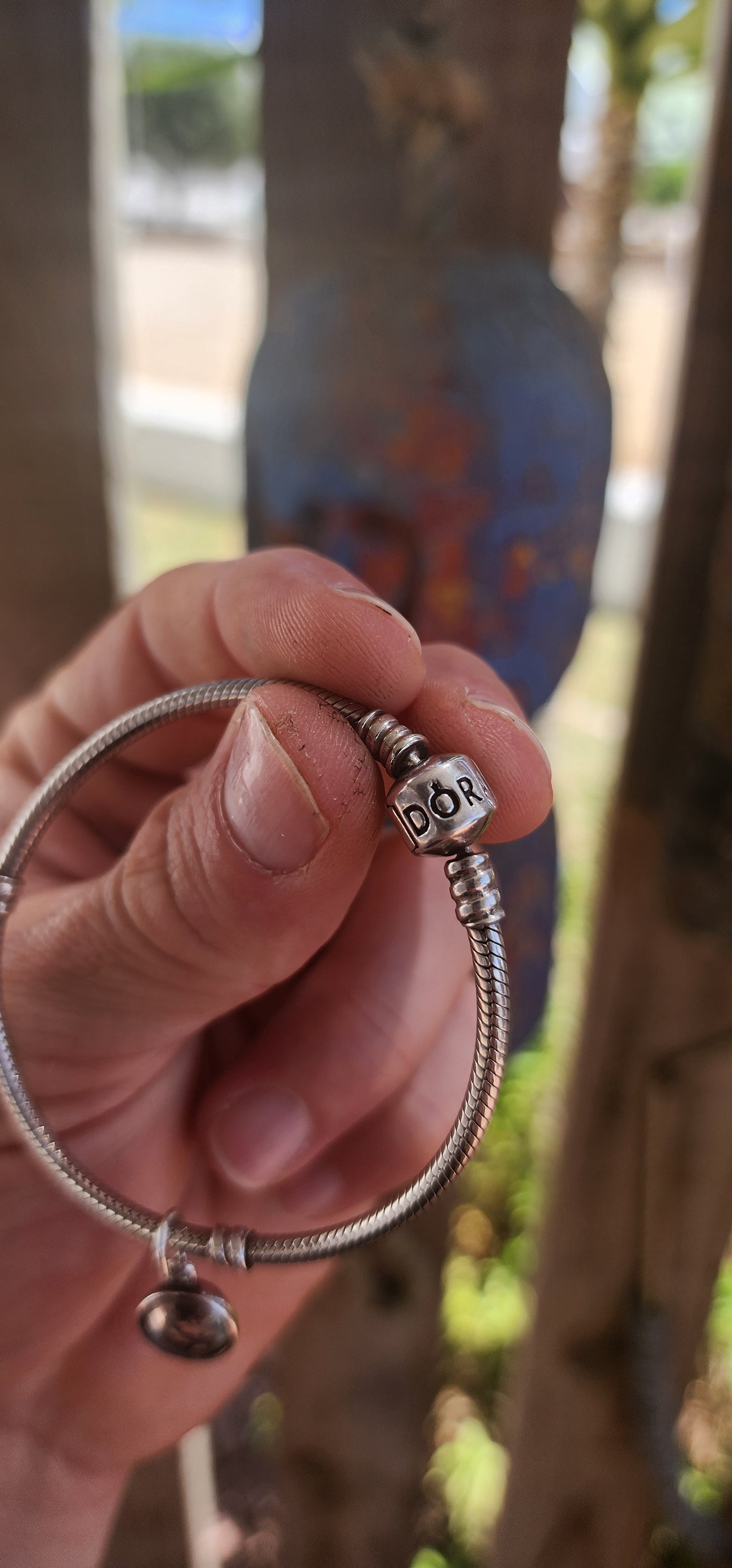 A beautifully wearable Pandora sterling silver snake chain bracelet, paired with a luminous prasiolite (green amethyst) dangle charm.