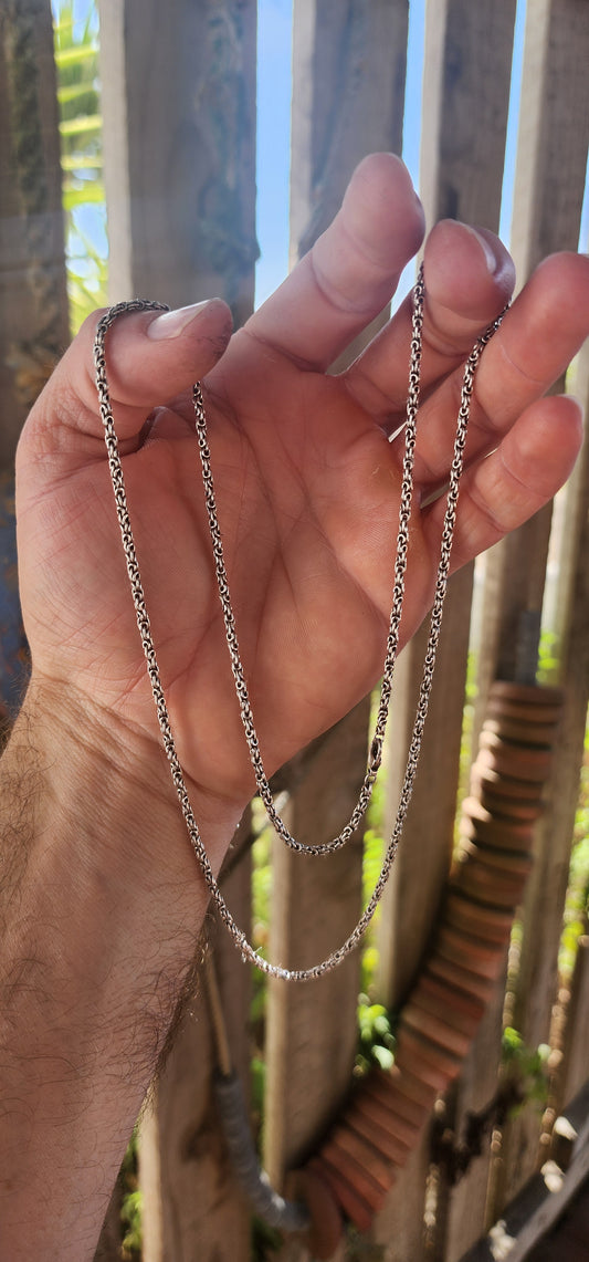 A marvelous vintage, extra-length solid sterling silver chain crafted in the intricate King’s Byzantine link, one of the most complex and visually rich chain designs in jewellery history.