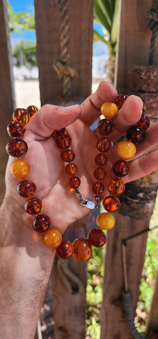 This is a proper, old-soul natural Baltic amber necklace with that rich, glowing, prehistoric energy.