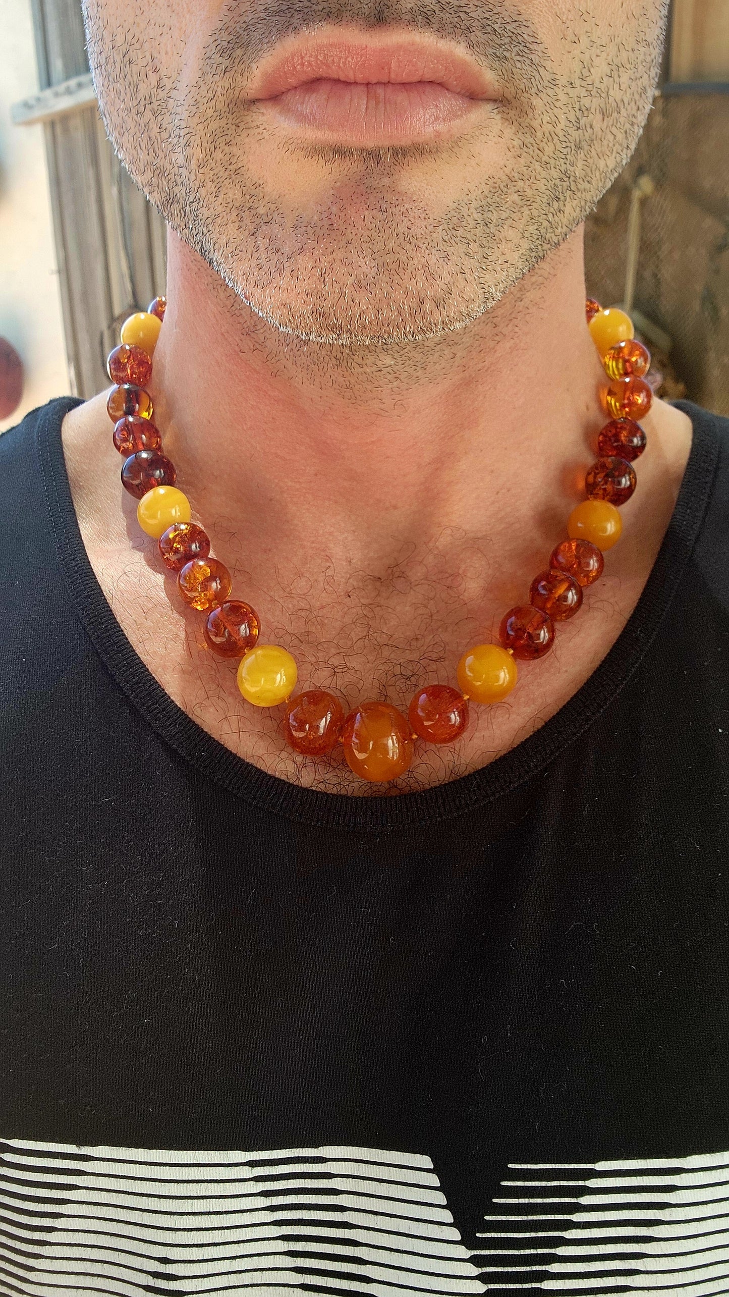This is a proper, old-soul natural Baltic amber necklace with that rich, glowing, prehistoric energy.