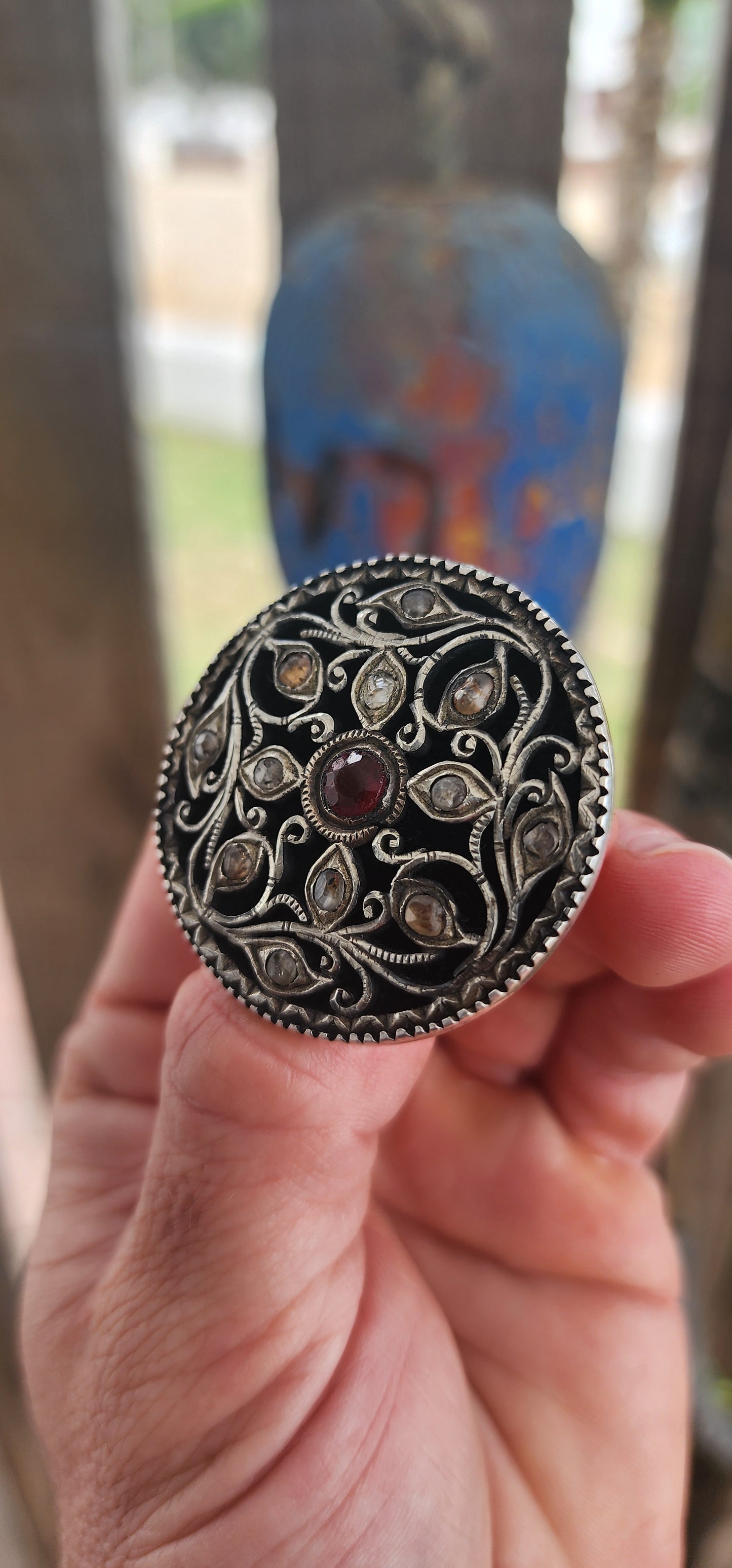 This extraordinary round brooch is crafted in 800-grade silver and represents traditional Javanese / Indonesian silversmithing, dating to the late Victorian period (late 1800s)