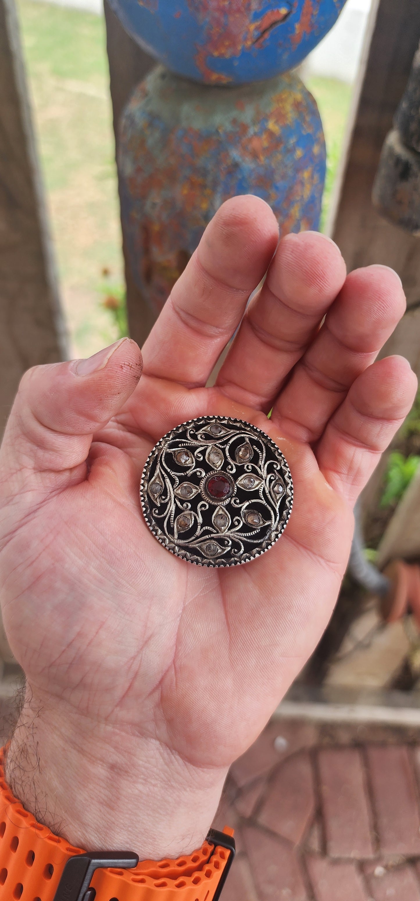 This extraordinary round brooch is crafted in 800-grade silver and represents traditional Javanese / Indonesian silversmithing, dating to the late Victorian period (late 1800s)