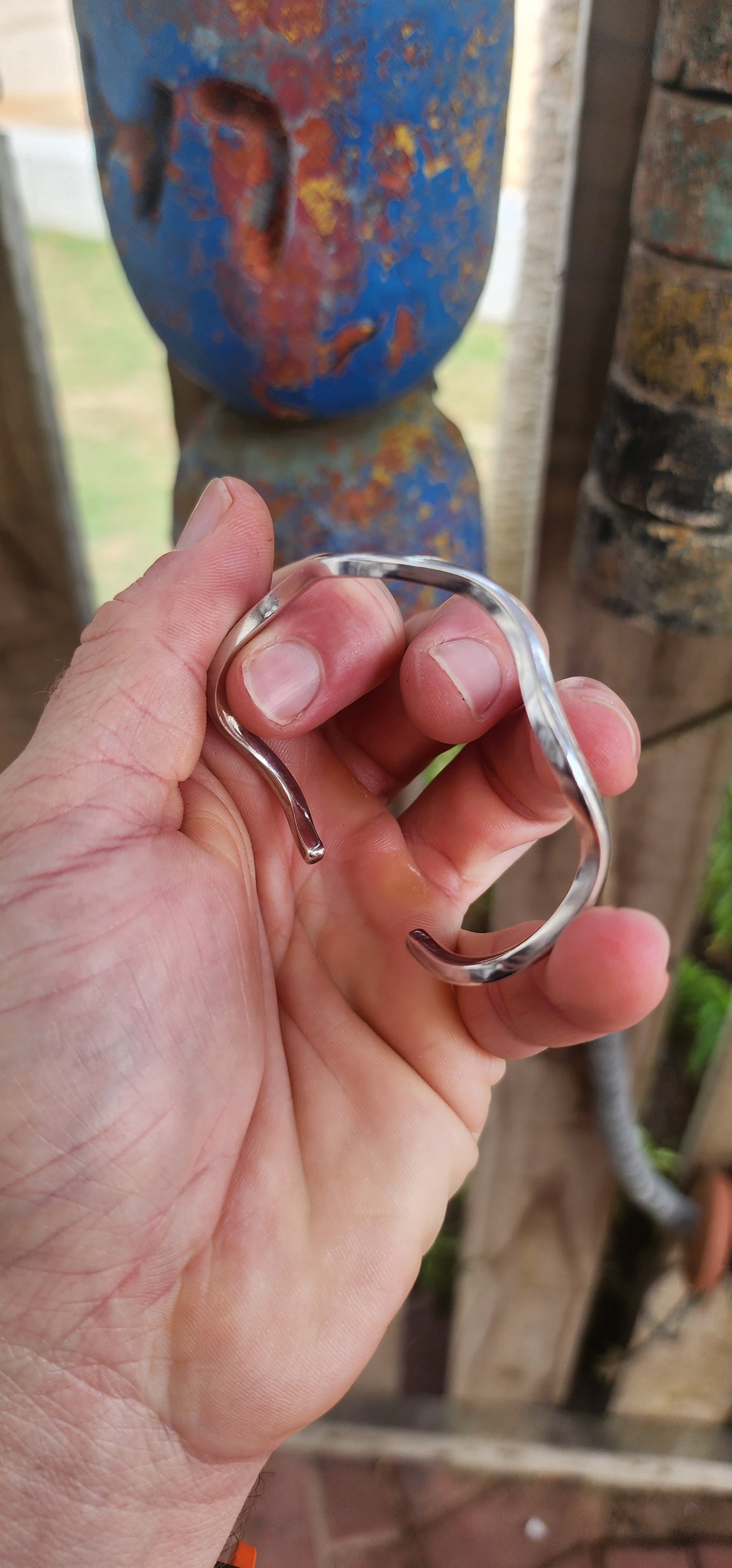 This striking solid sterling silver cuff is all about clean lines and fluid movement.