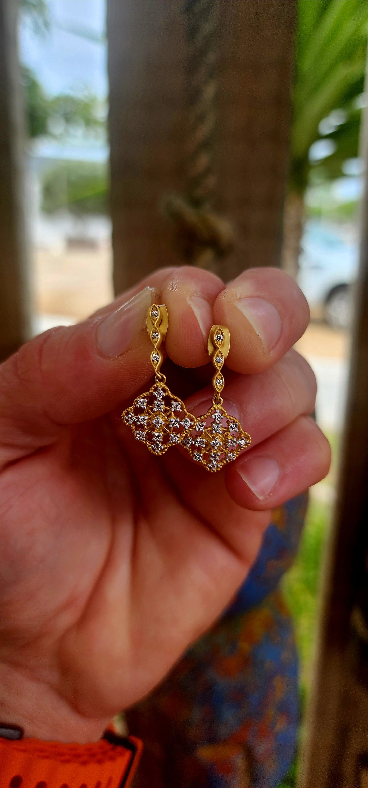 This beautiful pair of antique-revival drop earrings is crafted in sterling silver, finished with a soft matte yellow-gold plating that gives the piece a warm, understated glow reminiscent of true vintage/antique jewellery.