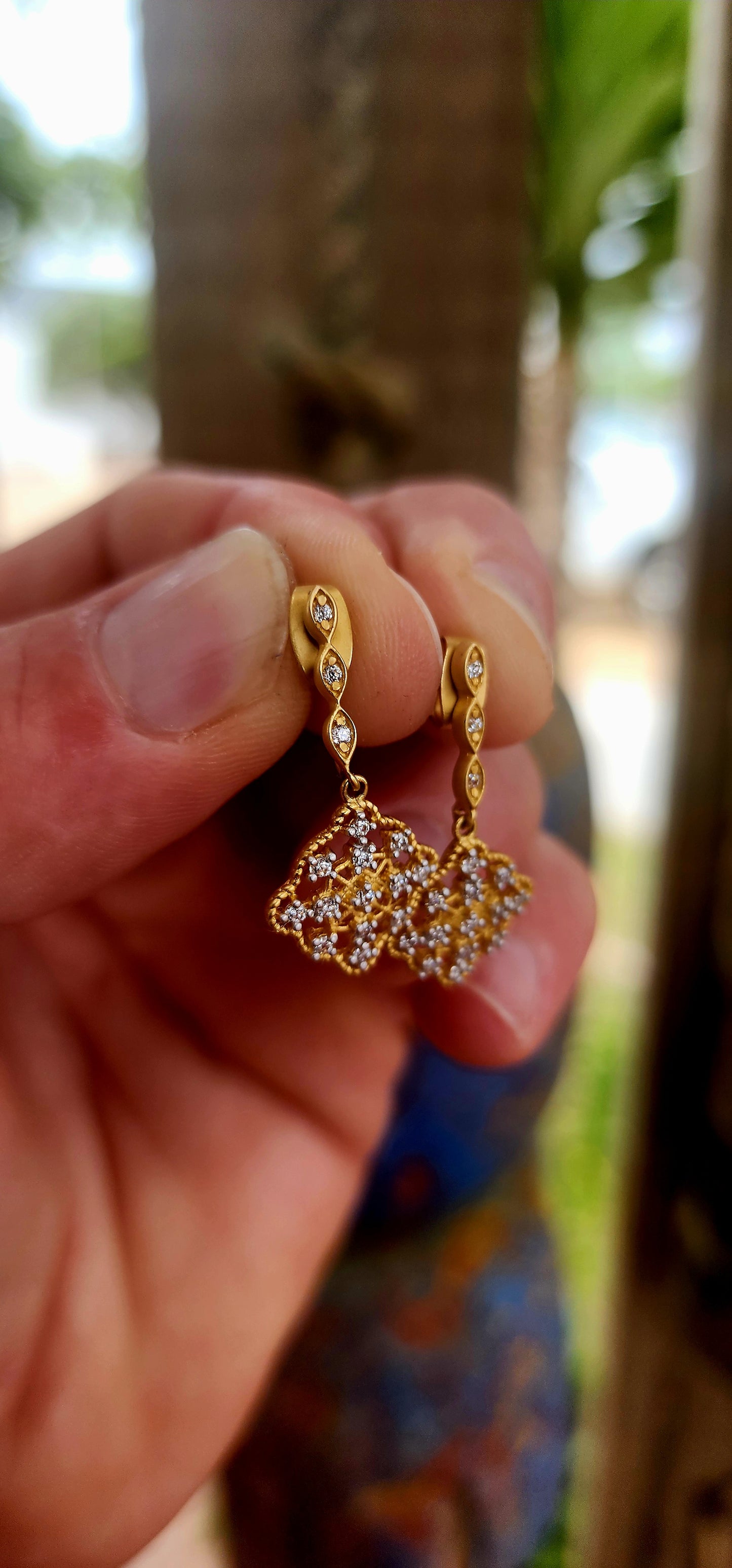 This beautiful pair of antique-revival drop earrings is crafted in sterling silver, finished with a soft matte yellow-gold plating that gives the piece a warm, understated glow reminiscent of true vintage/antique jewellery.