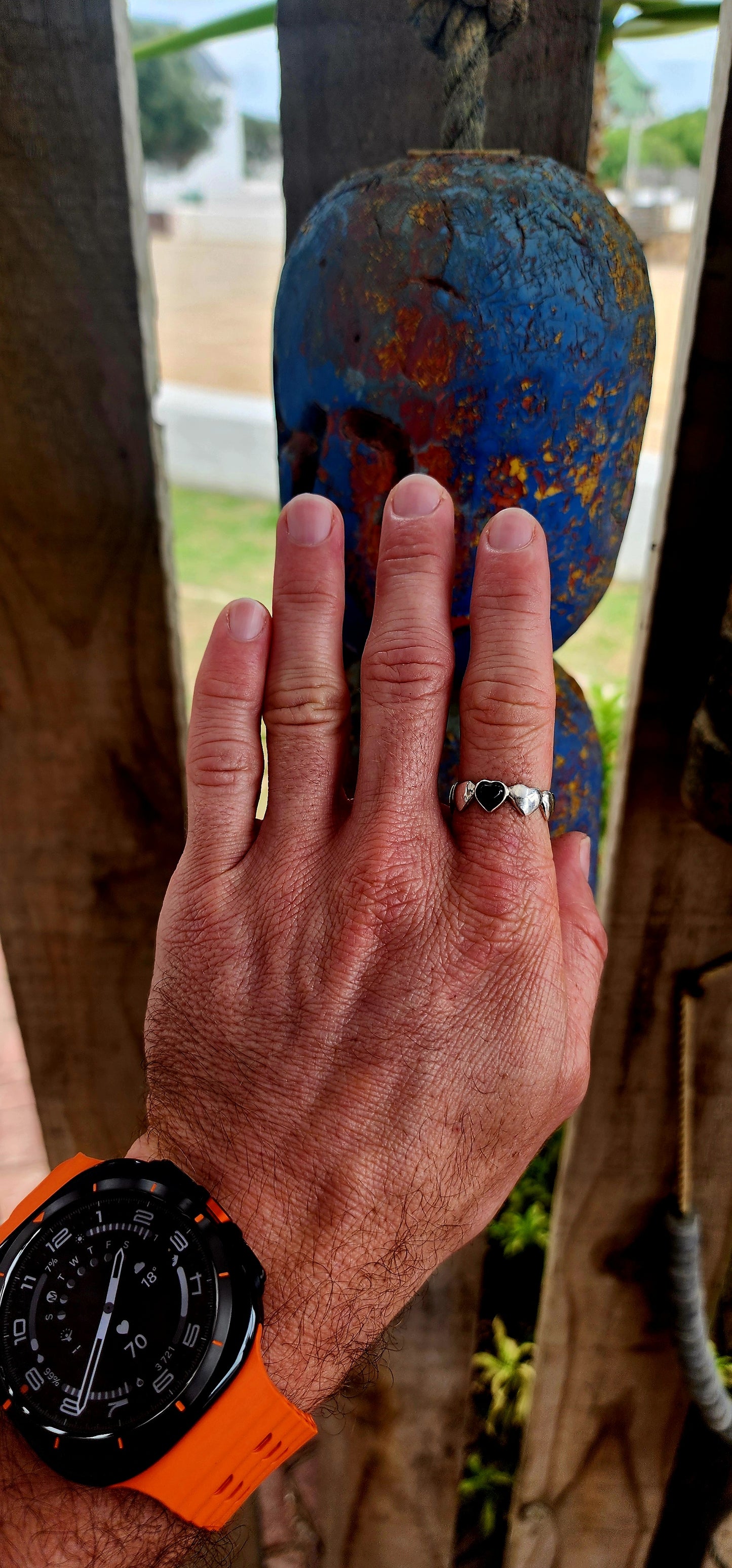 This artisan-made sterling silver ring is a full eternity style band featuring softly domed silver hearts wrapping all the way around the finger.