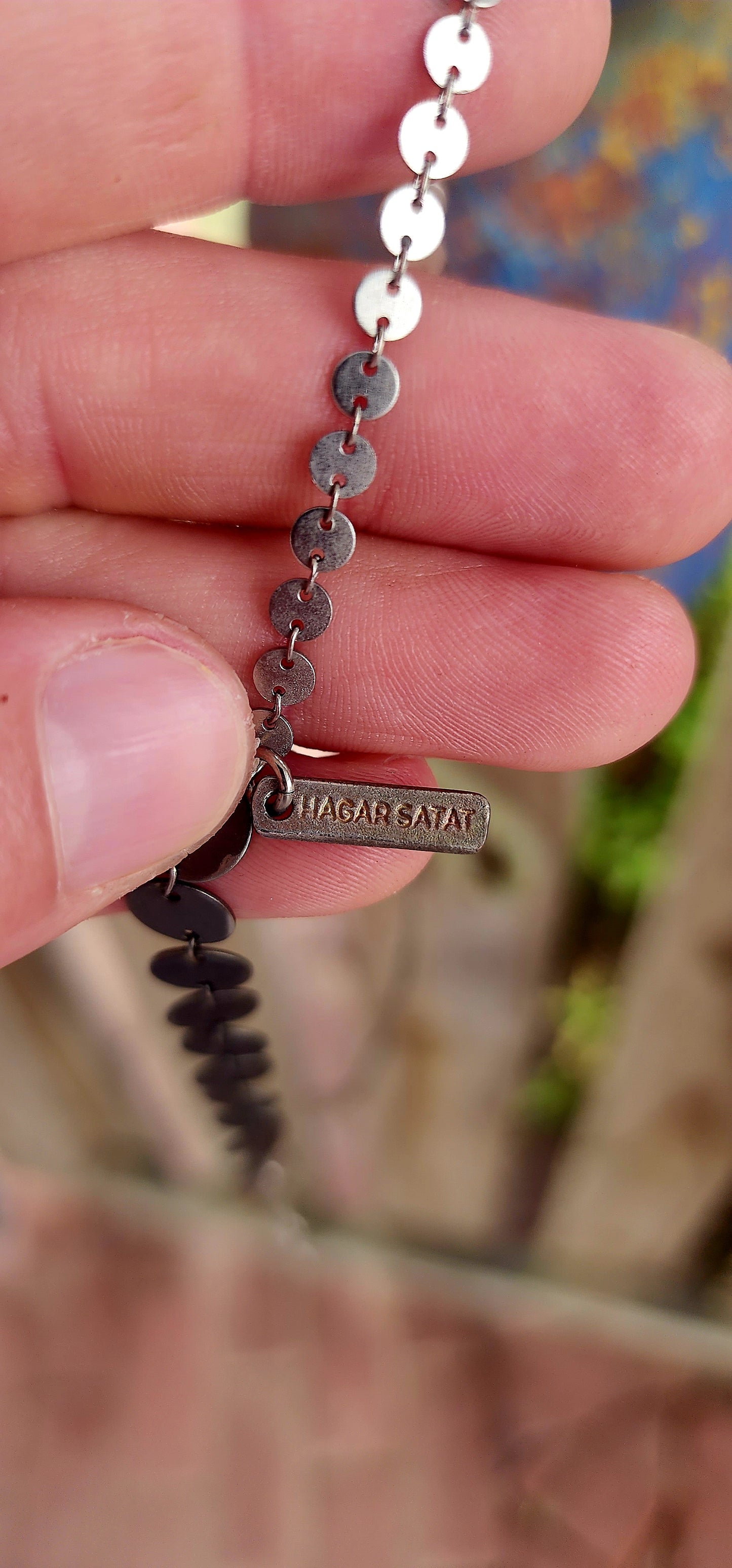 This unusual extra-length designer necklace is crafted by renowned Israeli jewellery designer Hagar Satat — known for her architectural, industrial-inspired pieces that balance femininity with raw structure.