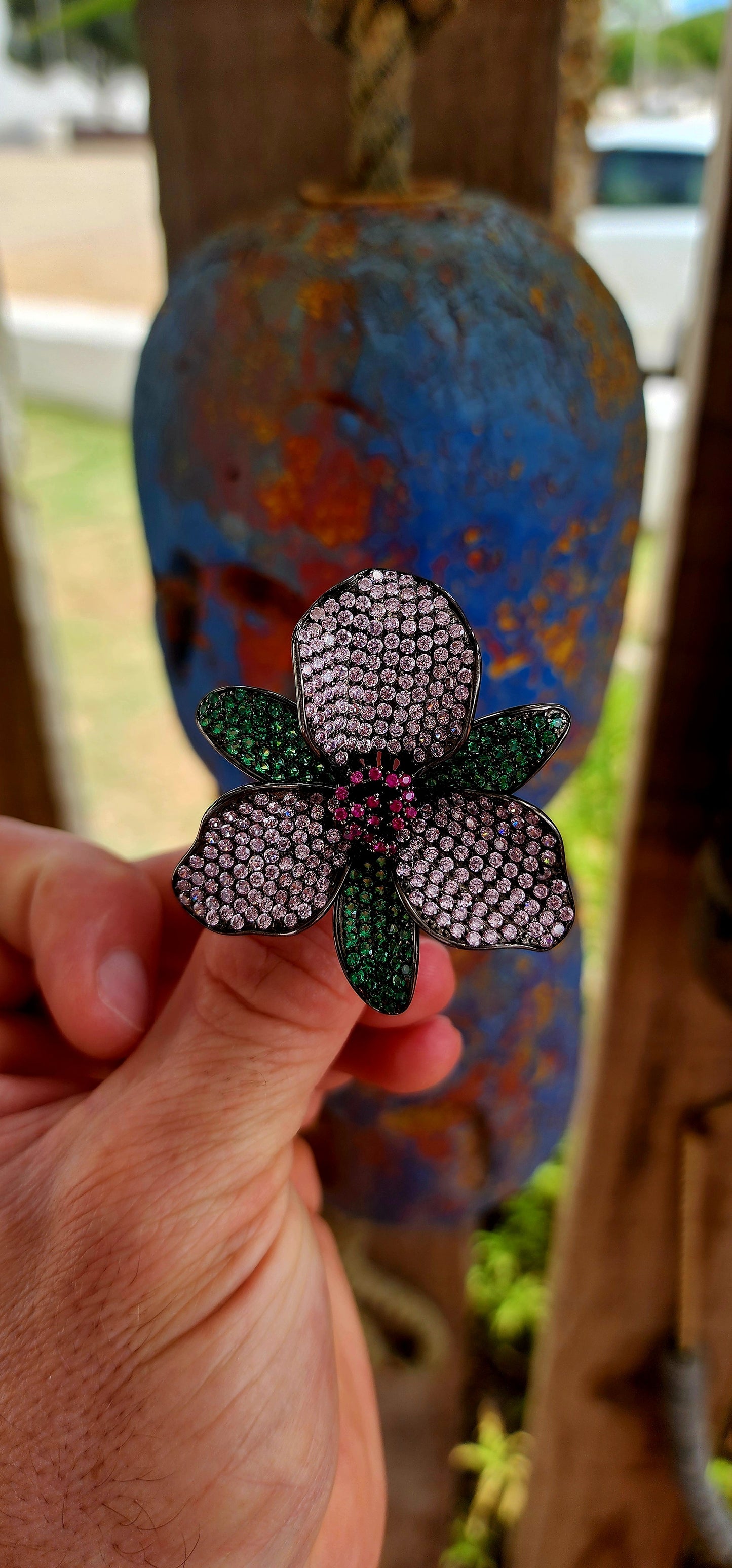 A magical, three-dimensional flower brought to life in rich blackened sterling silver — giving it that moody, gothic, almost midnight-garden energy.