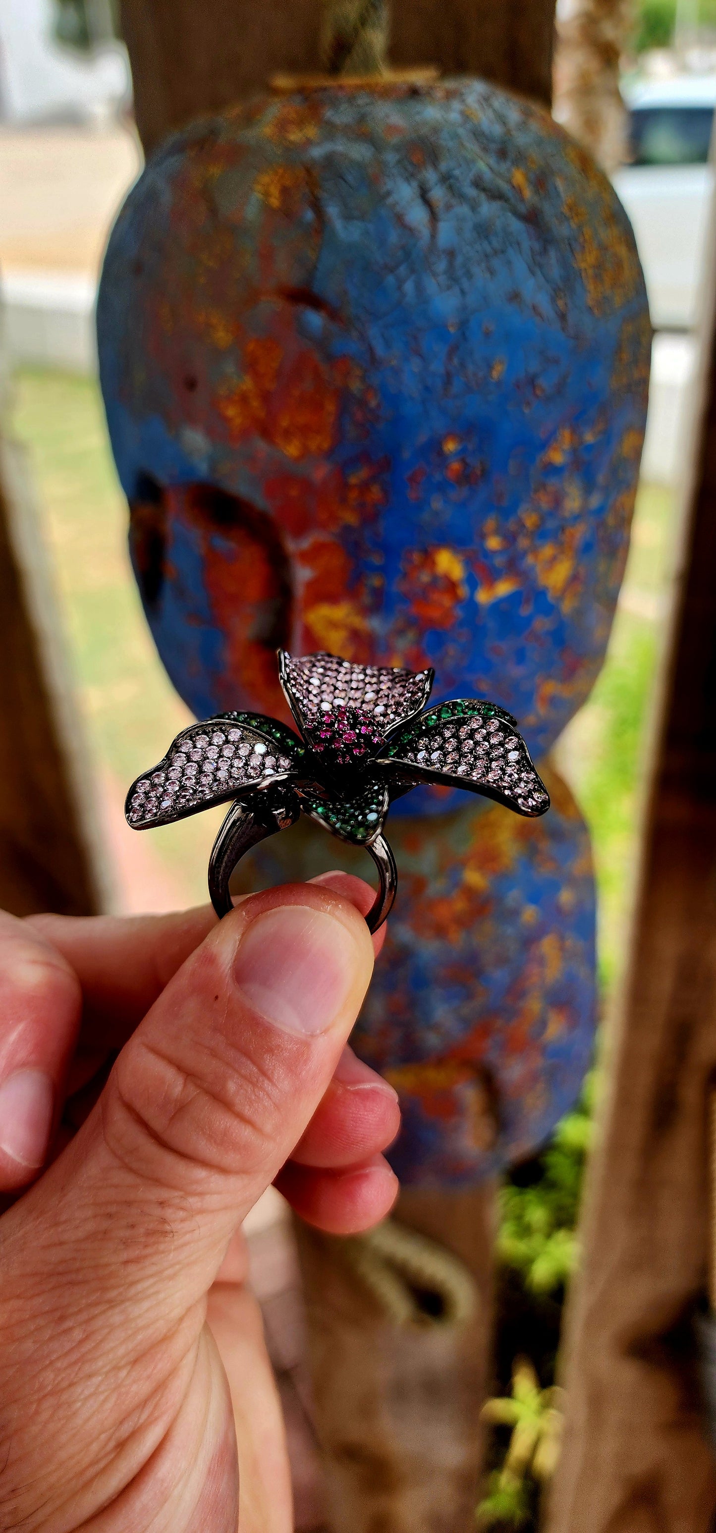 A magical, three-dimensional flower brought to life in rich blackened sterling silver — giving it that moody, gothic, almost midnight-garden energy.