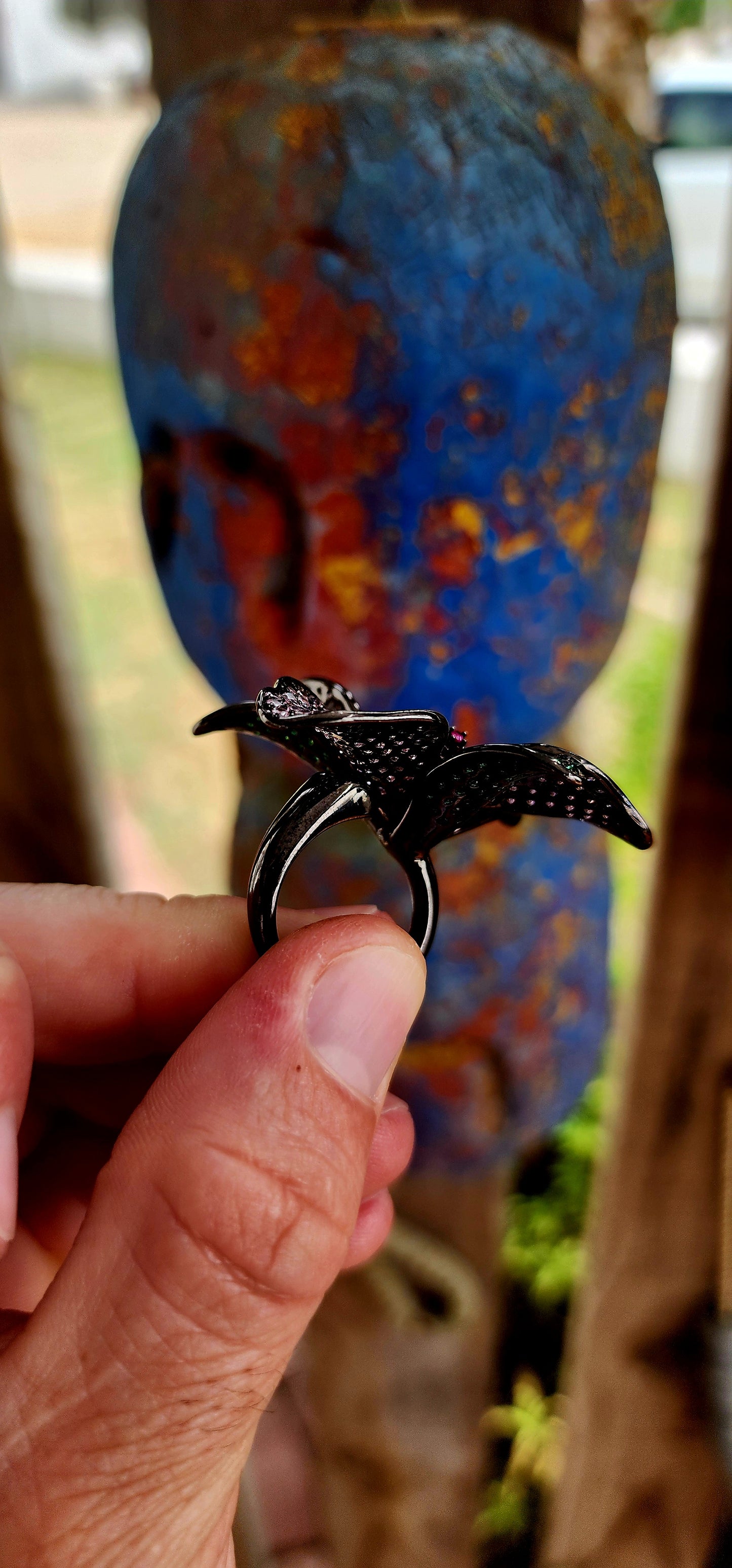 A magical, three-dimensional flower brought to life in rich blackened sterling silver — giving it that moody, gothic, almost midnight-garden energy.