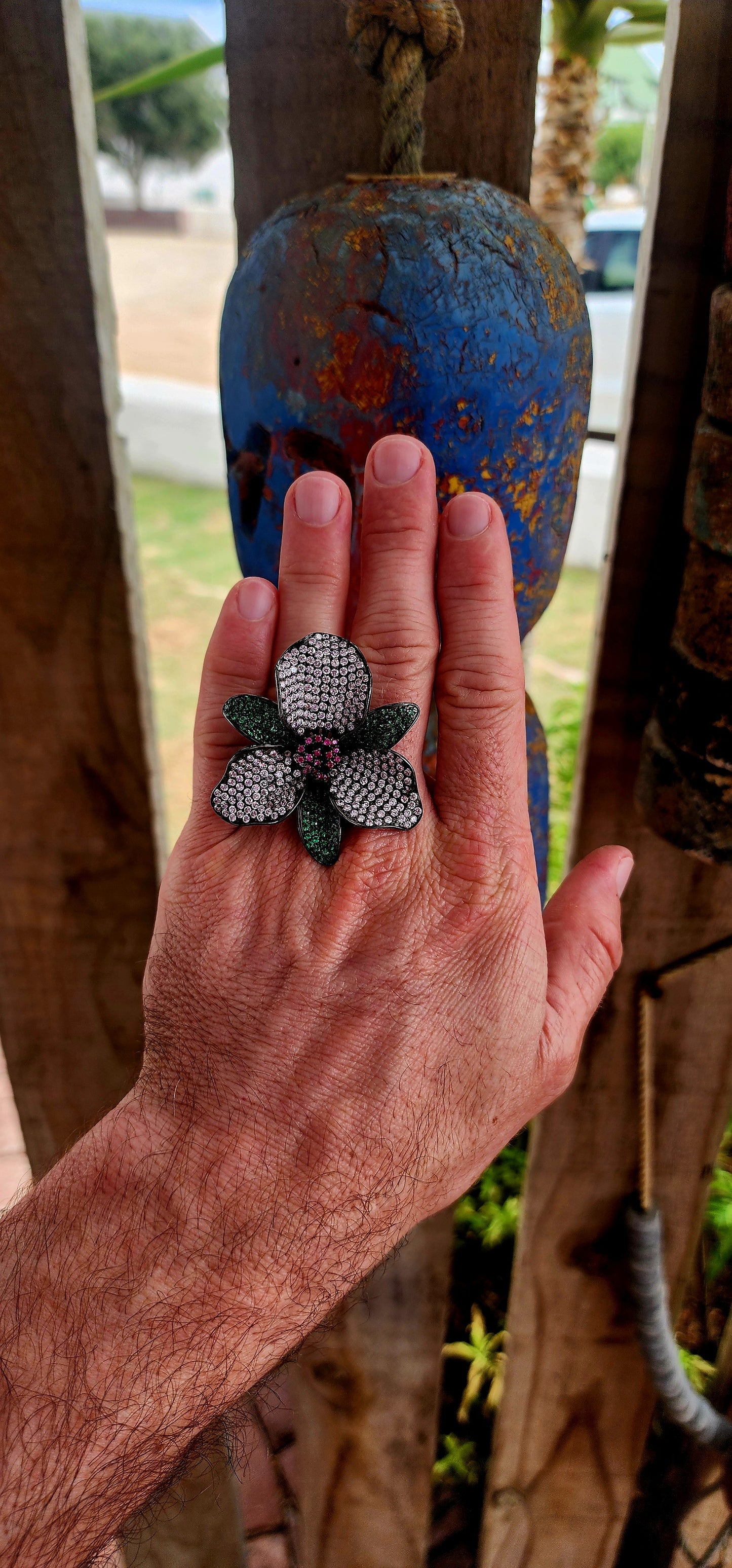 A magical, three-dimensional flower brought to life in rich blackened sterling silver — giving it that moody, gothic, almost midnight-garden energy.