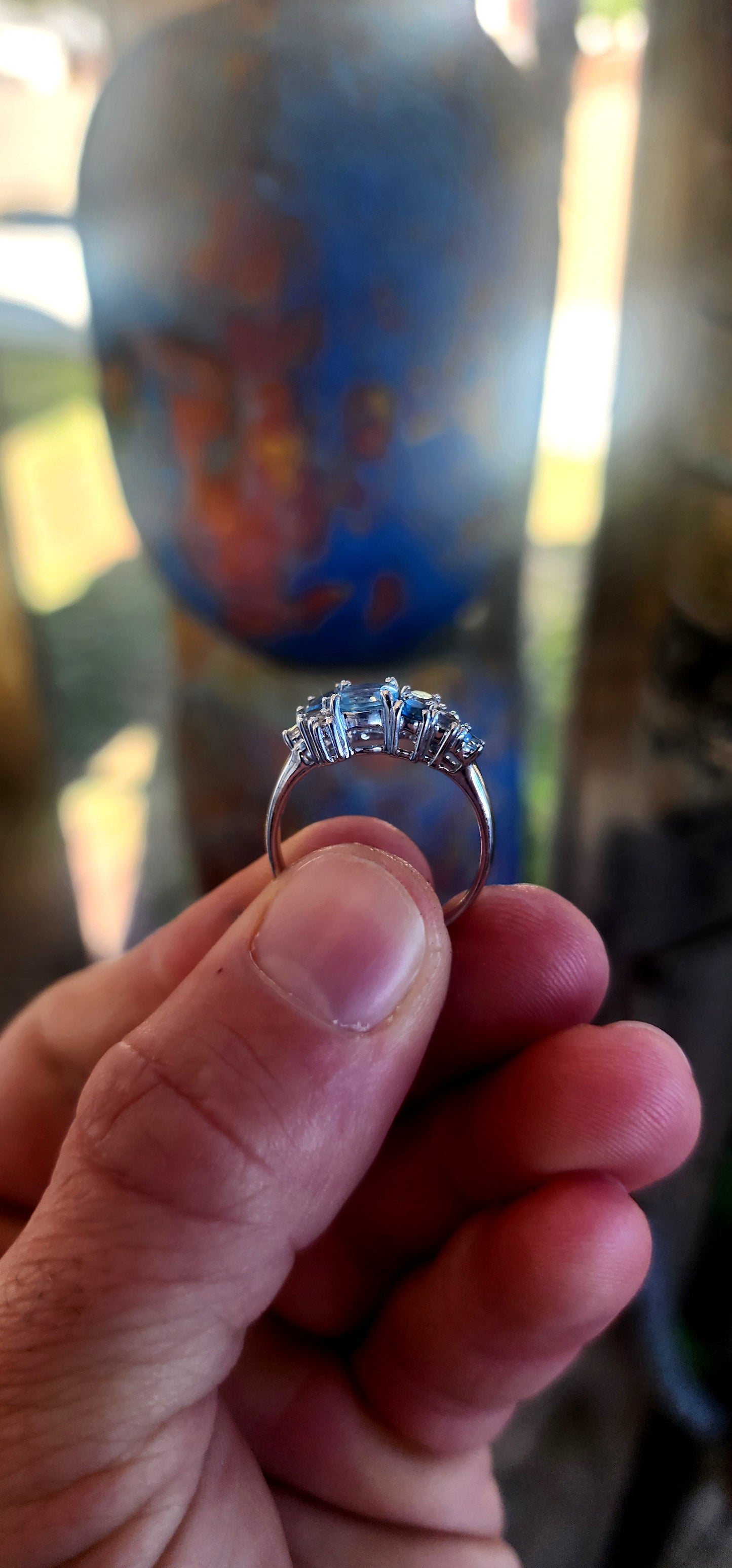 Crafted in solid sterling silver and finished with rhodium plating for a bright, tarnish-resistant white-gold look, this ring is a tribute to the beauty of topaz in all its shades of blue.